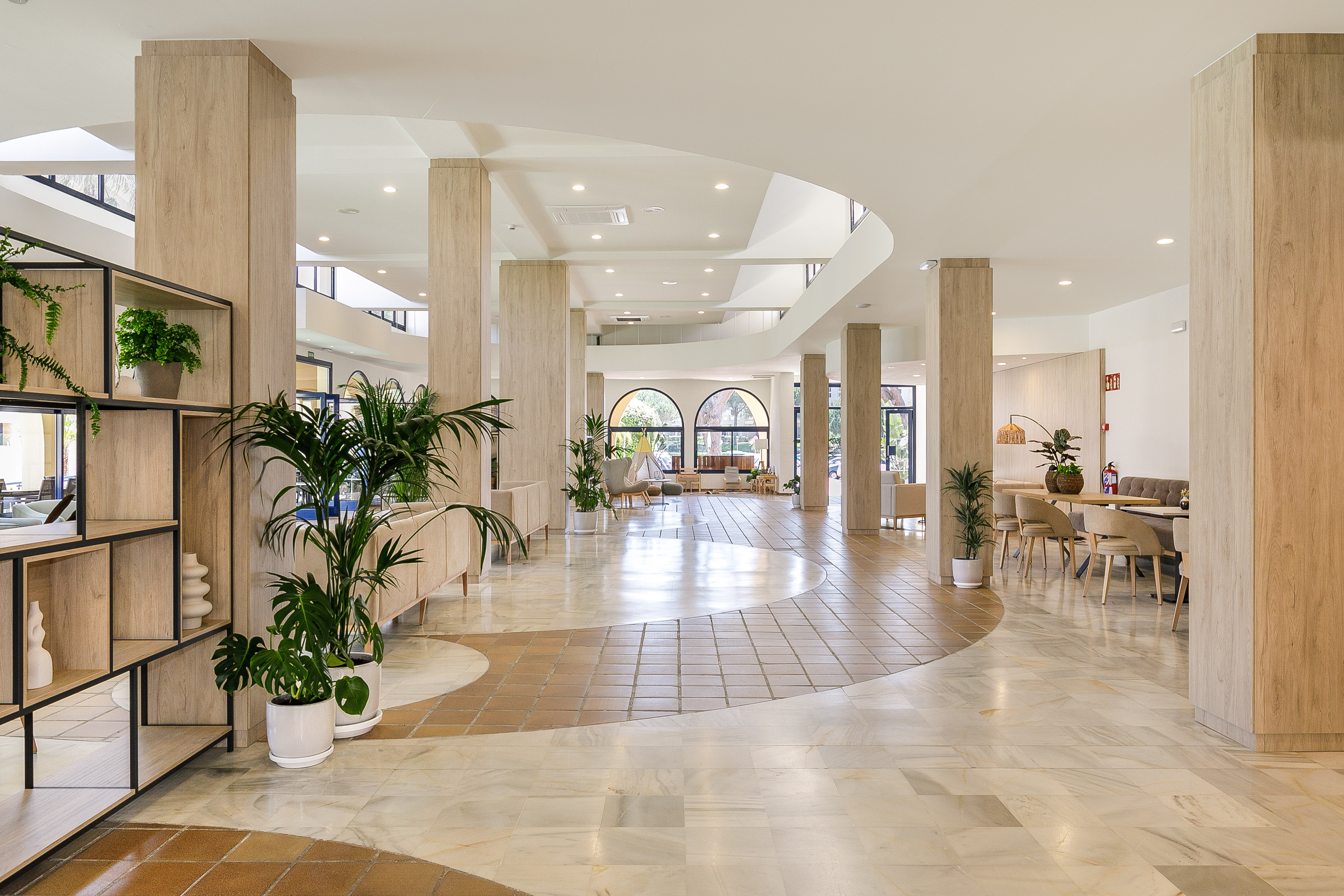 a large room with a large floor and columns
