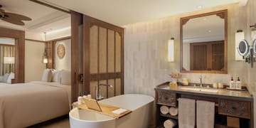 a bathroom with a bathtub and a mirror