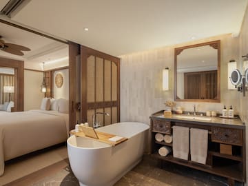 a bathroom with a bathtub and a mirror