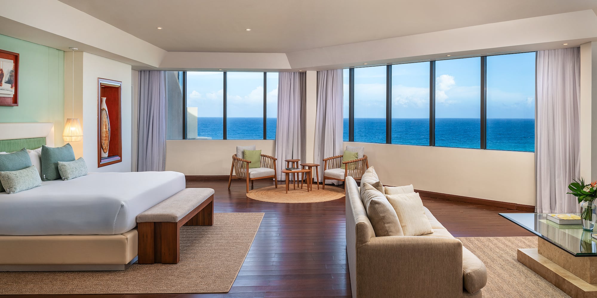 a room with a large window overlooking the ocean