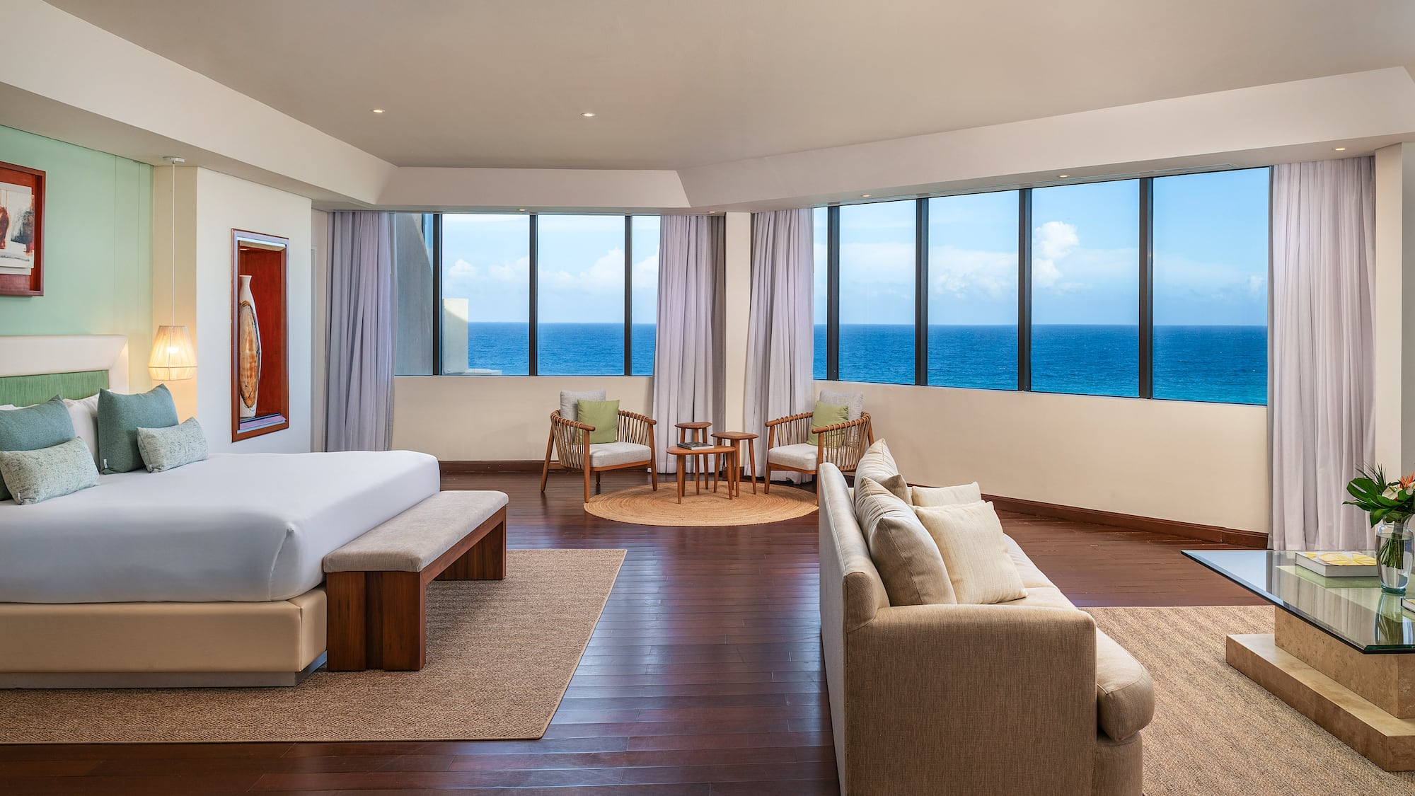 a room with a large window overlooking the ocean