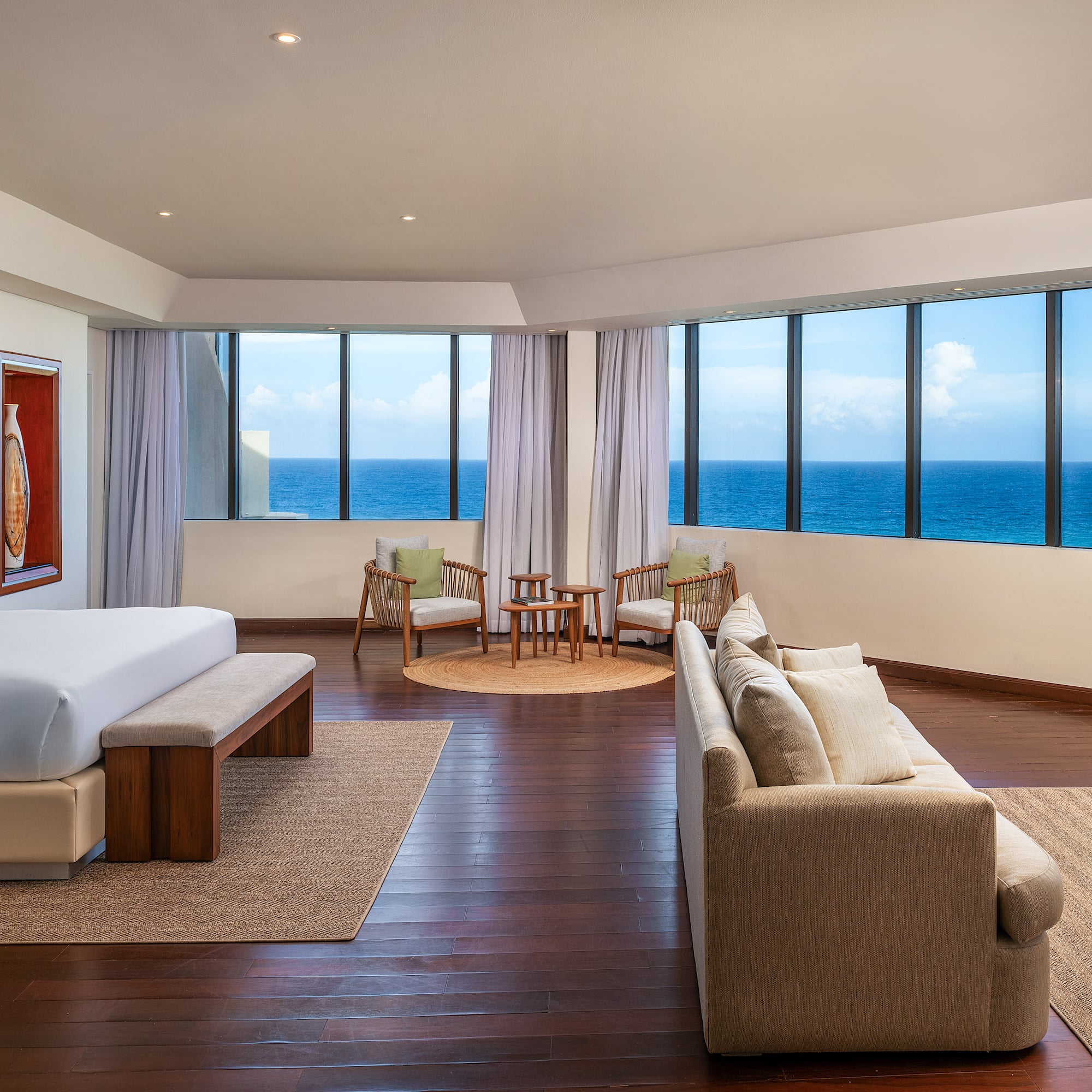 a room with a large window overlooking the ocean