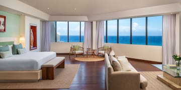 a room with a large window overlooking the ocean