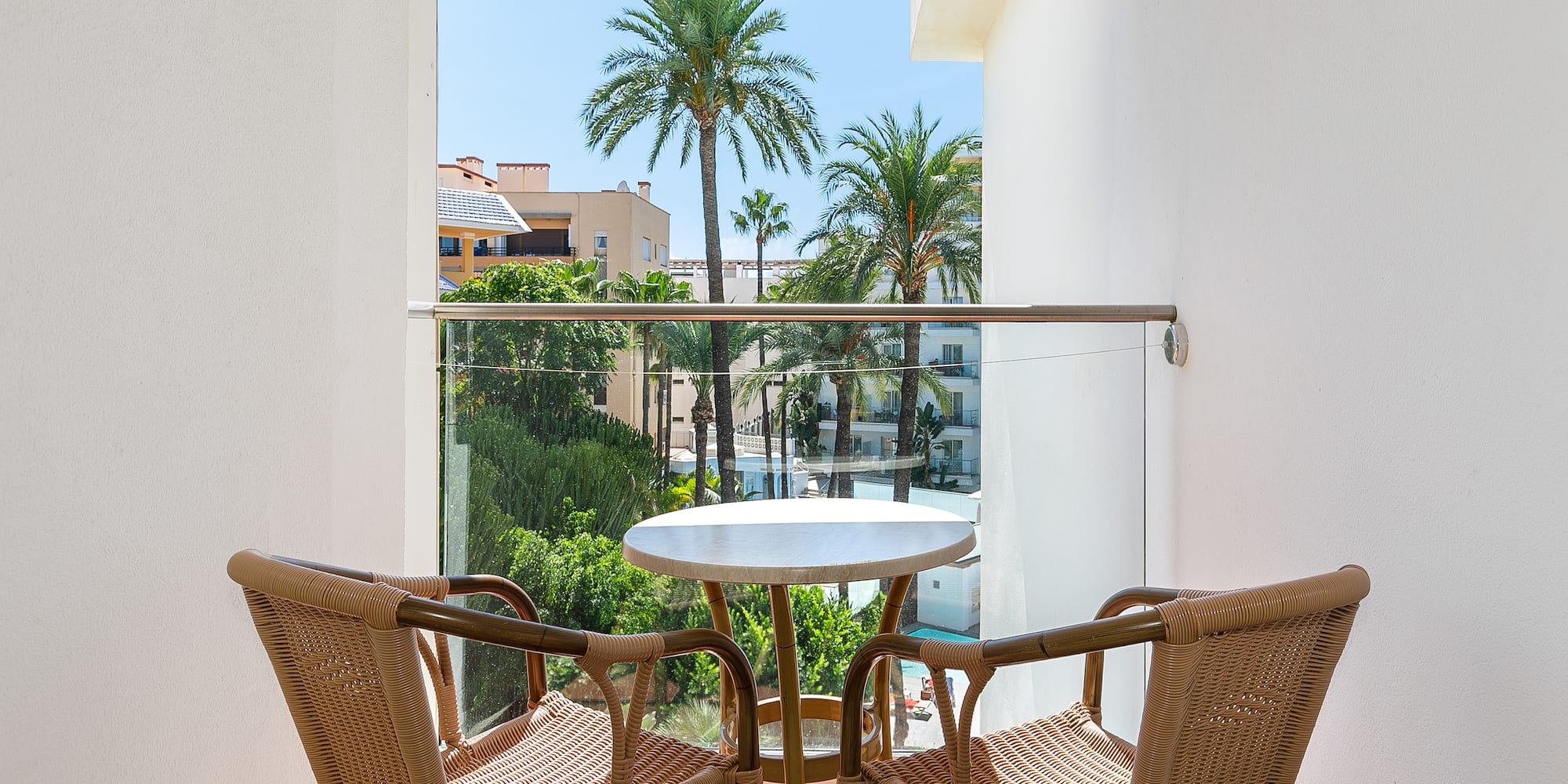 a table and chairs on a balcony