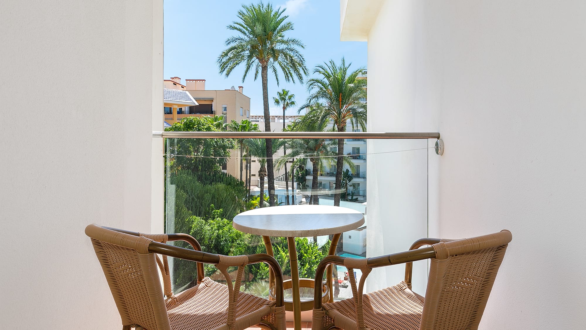 a table and chairs on a balcony