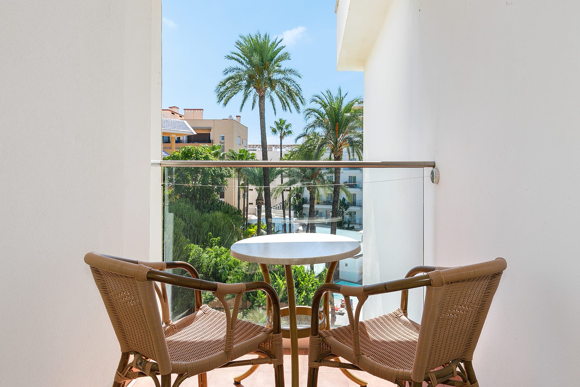 a table and chairs on a balcony