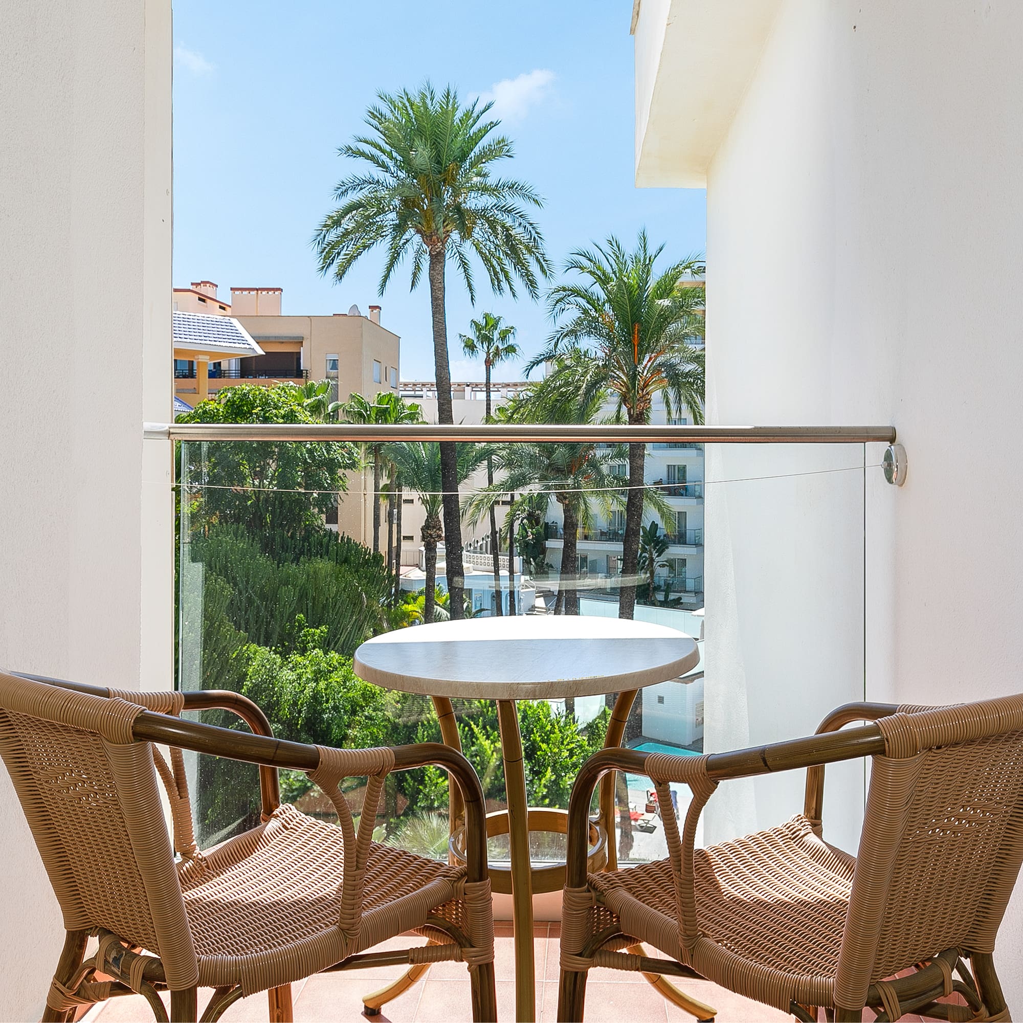 a table and chairs on a balcony