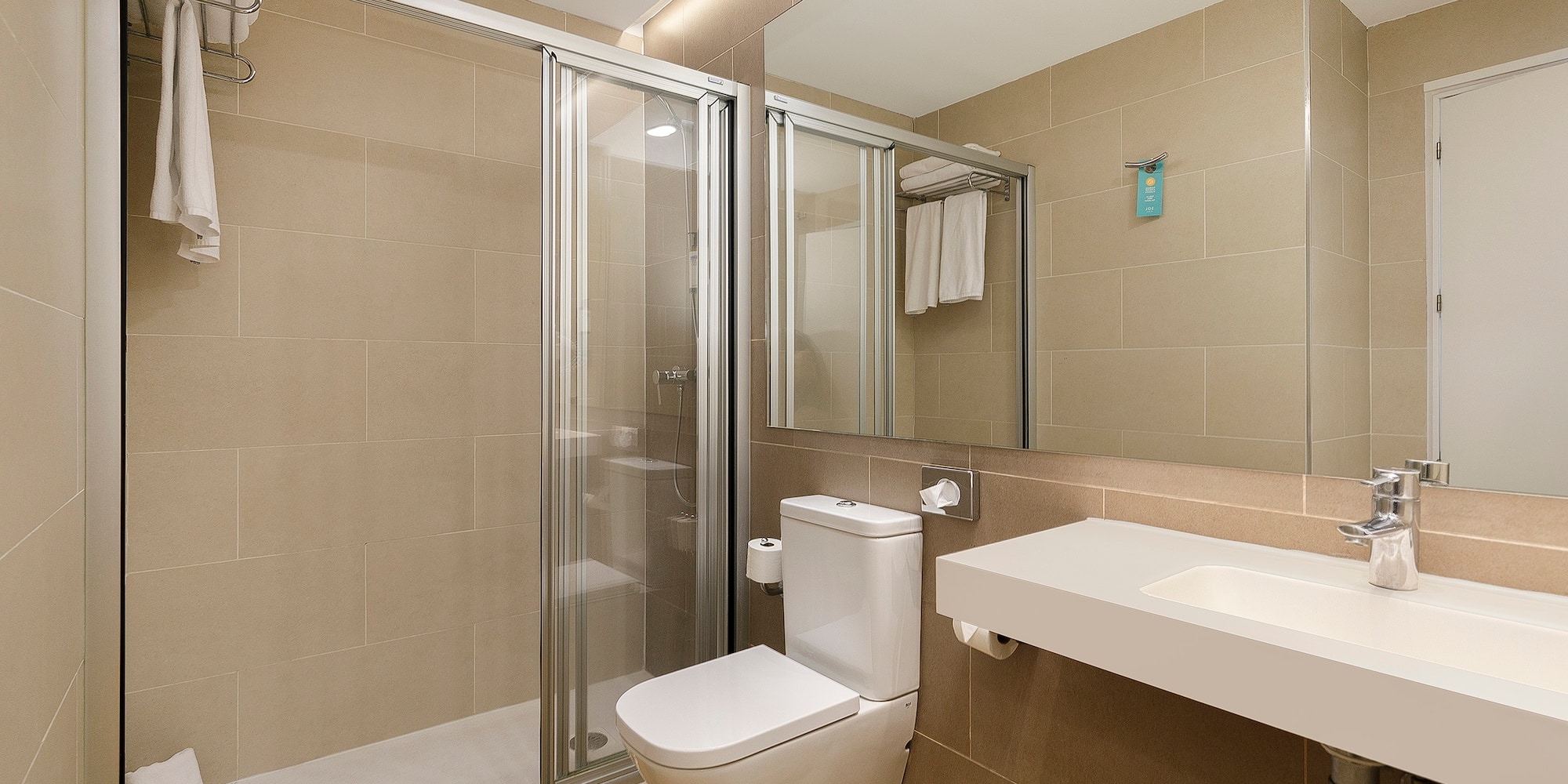 a bathroom with a shower and toilet