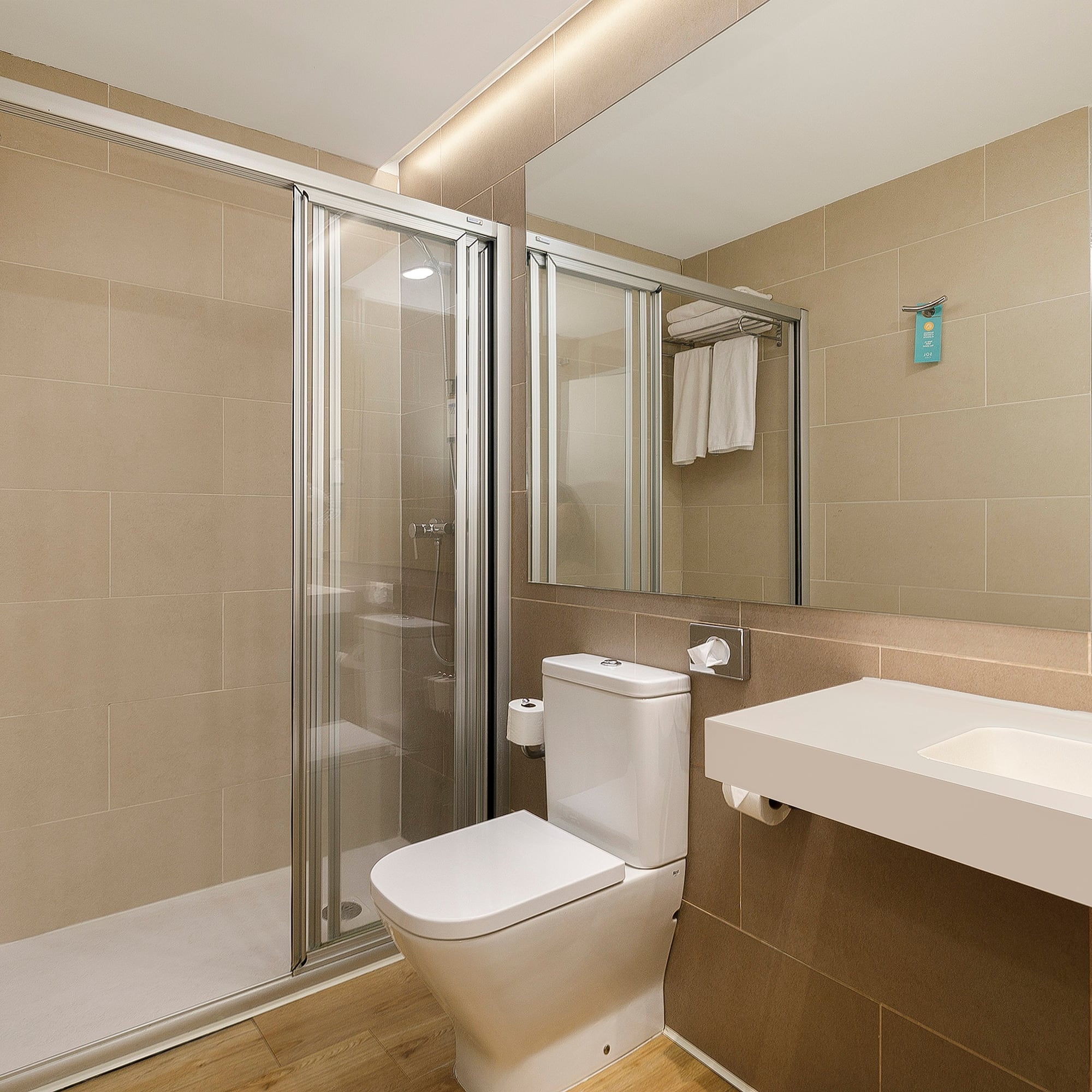 a bathroom with a shower and toilet