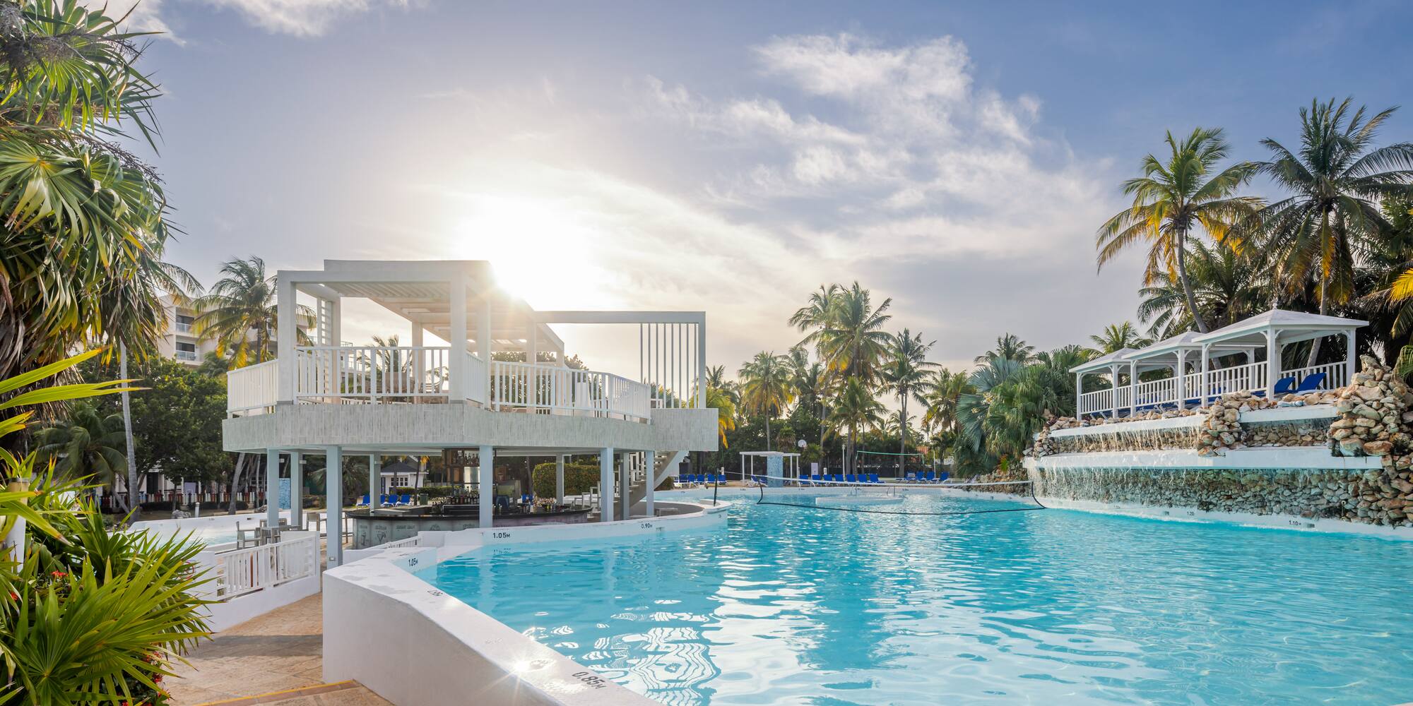 a pool with a deck and a building