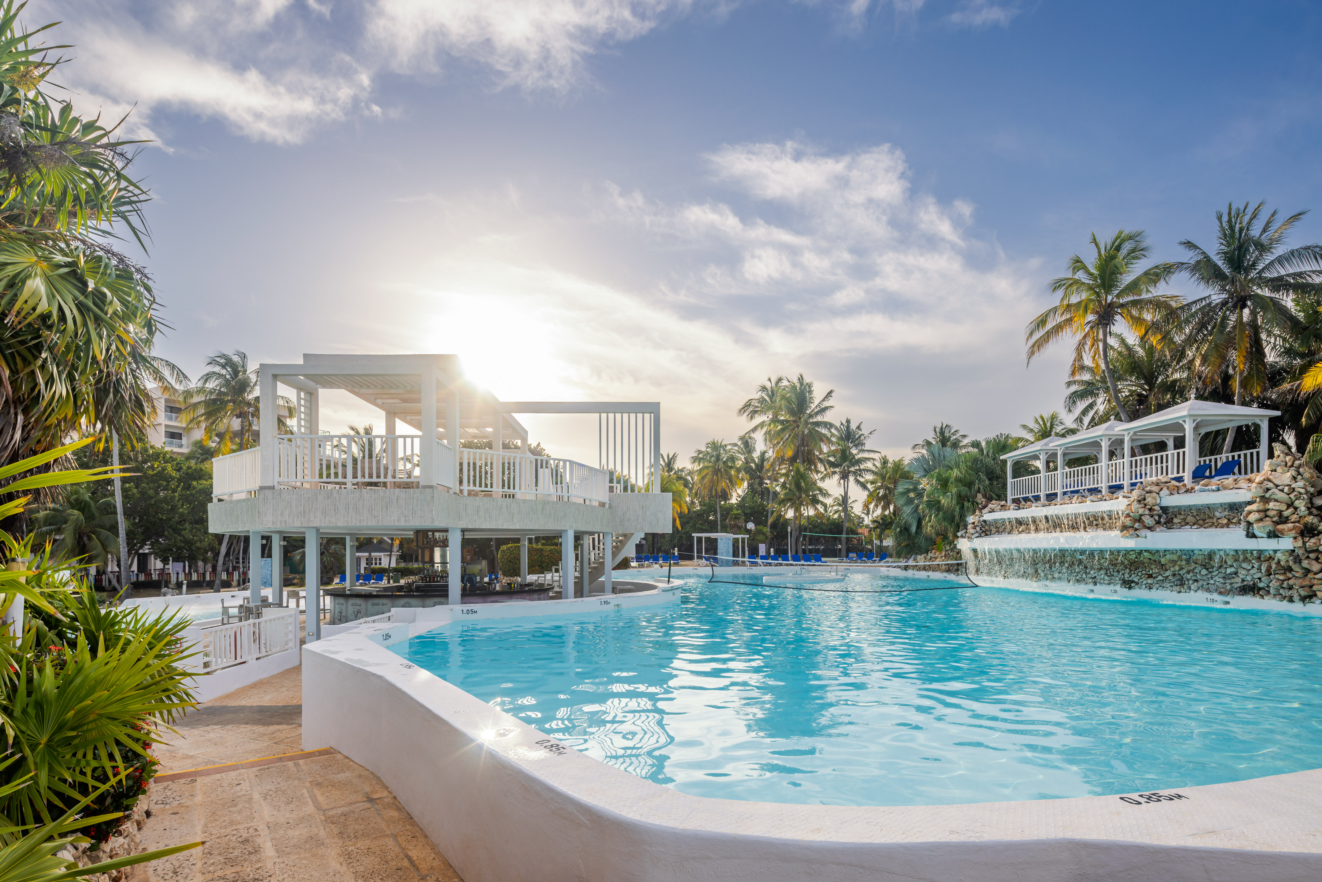 a pool with a deck and a building