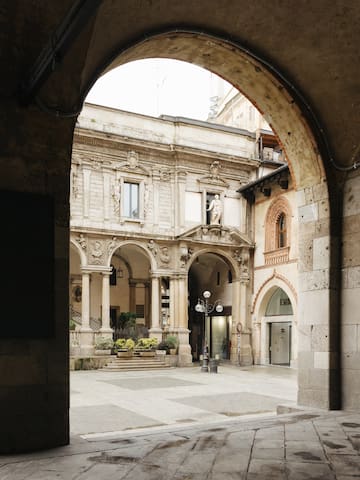 a stone archway with arches and columns