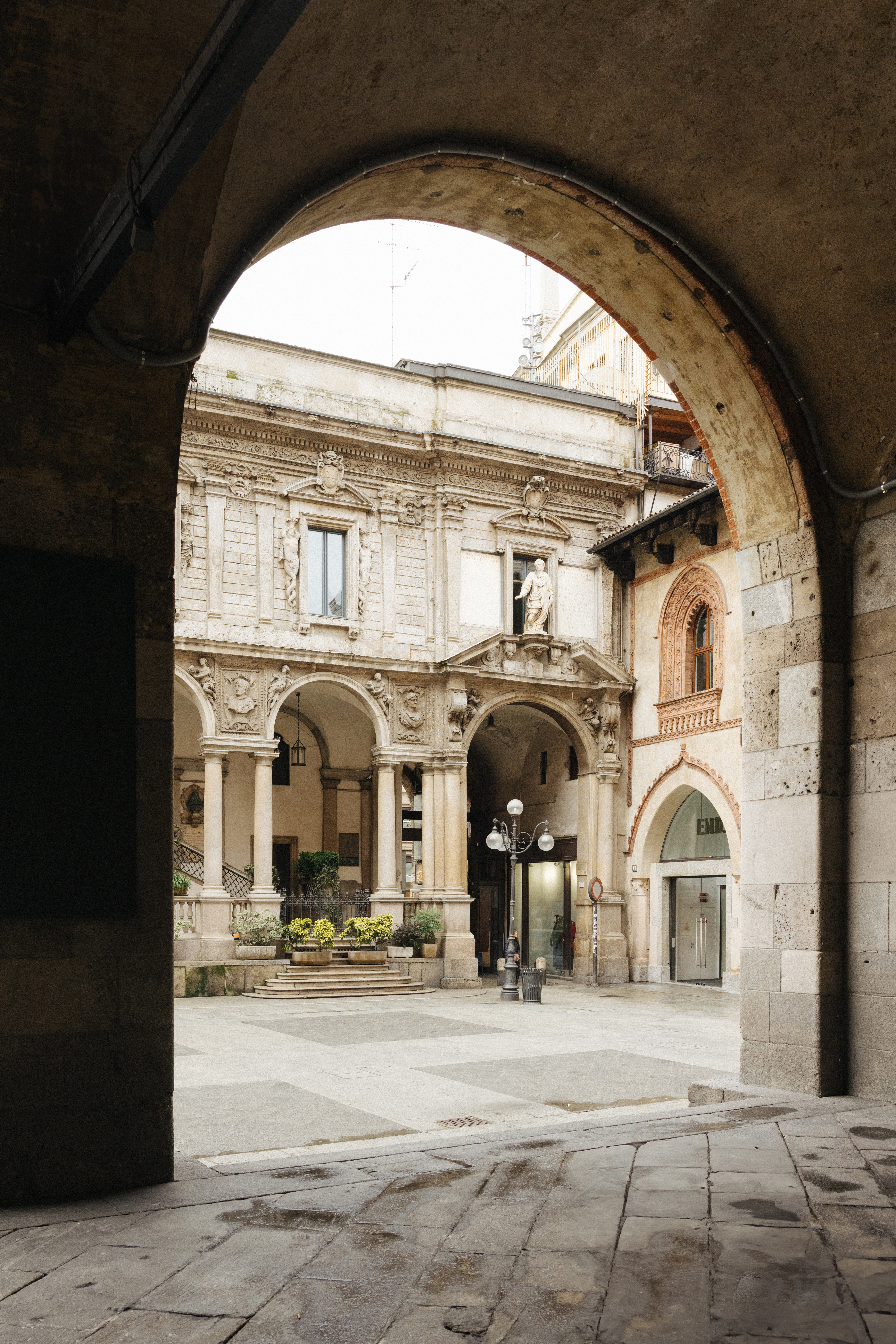 a stone archway with arches and columns
