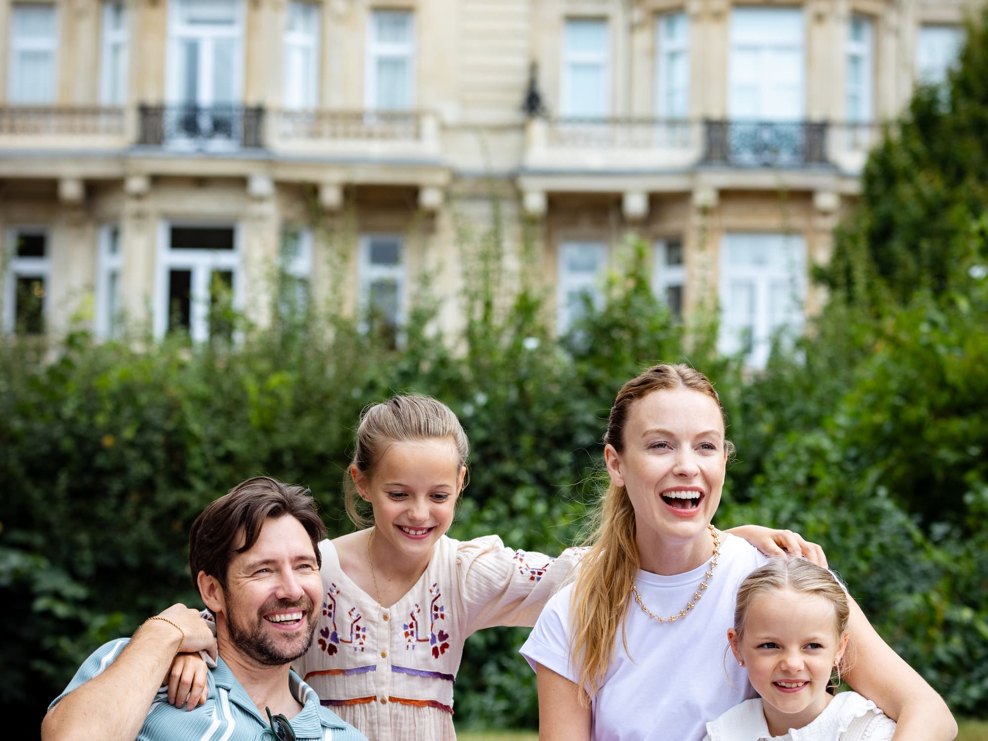 a group of people sitting on a picnic basket