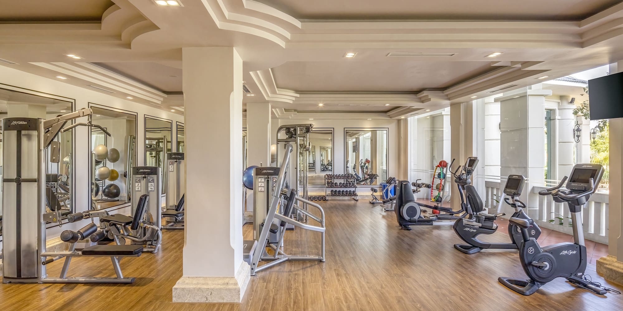 a large room with exercise equipment