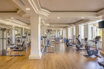a large room with exercise equipment