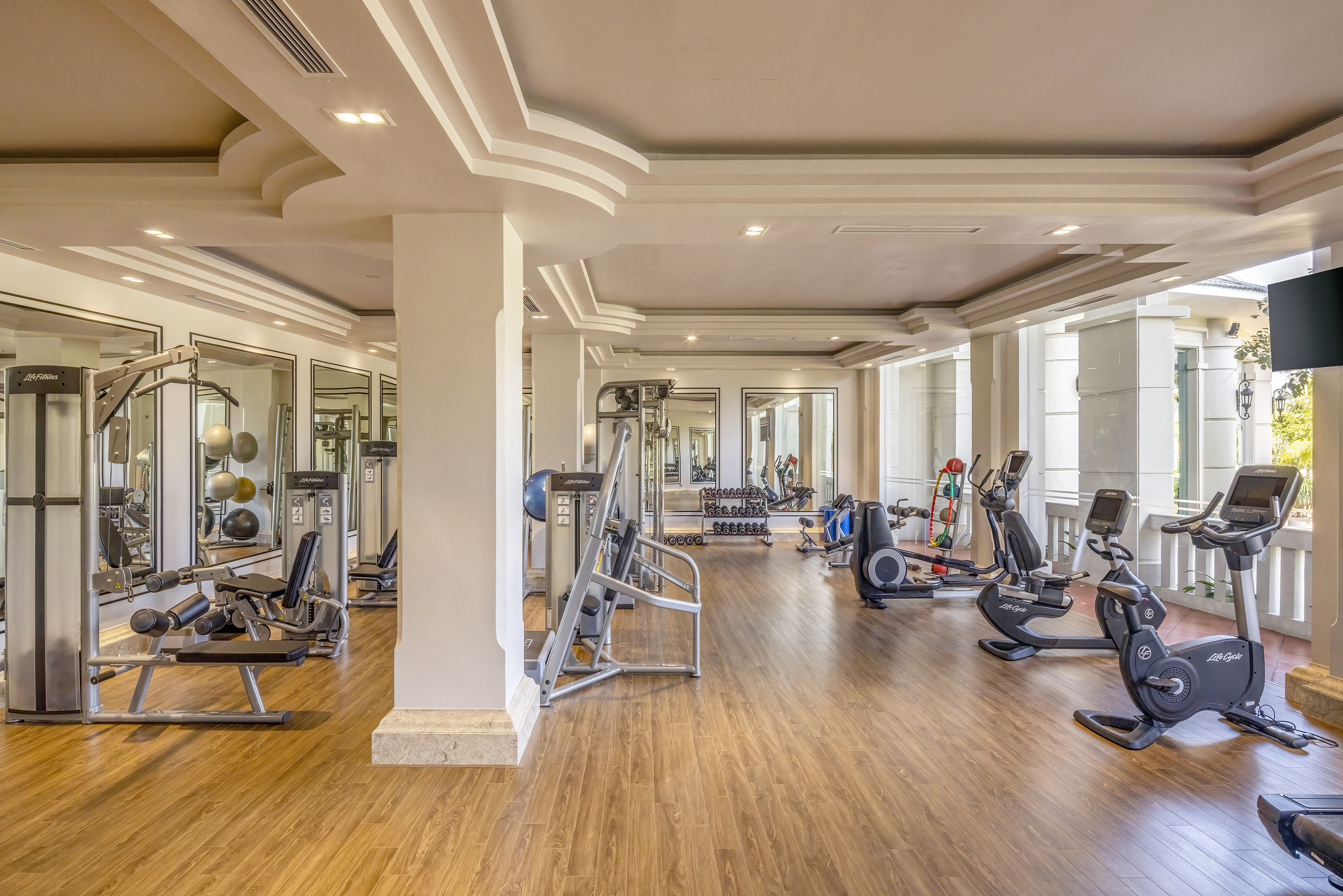 a large room with exercise equipment