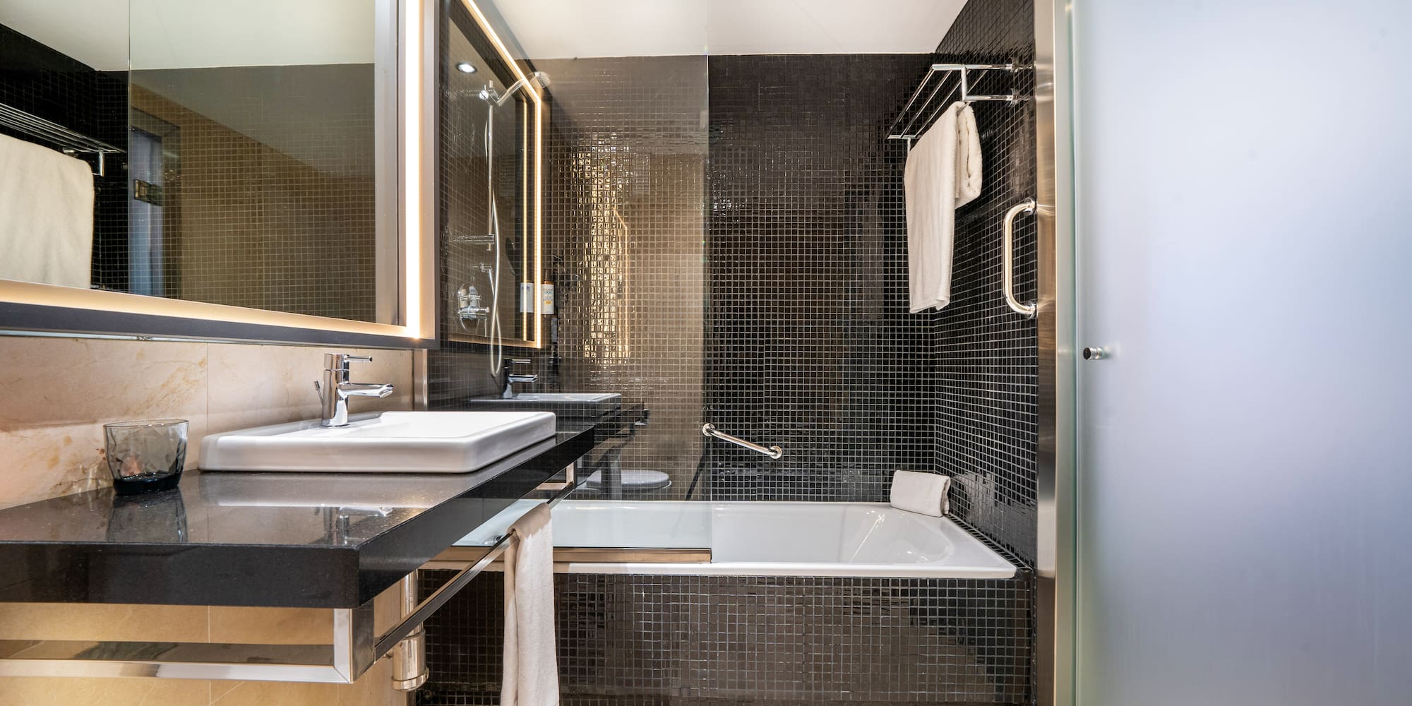 a bathroom with a bathtub and sink