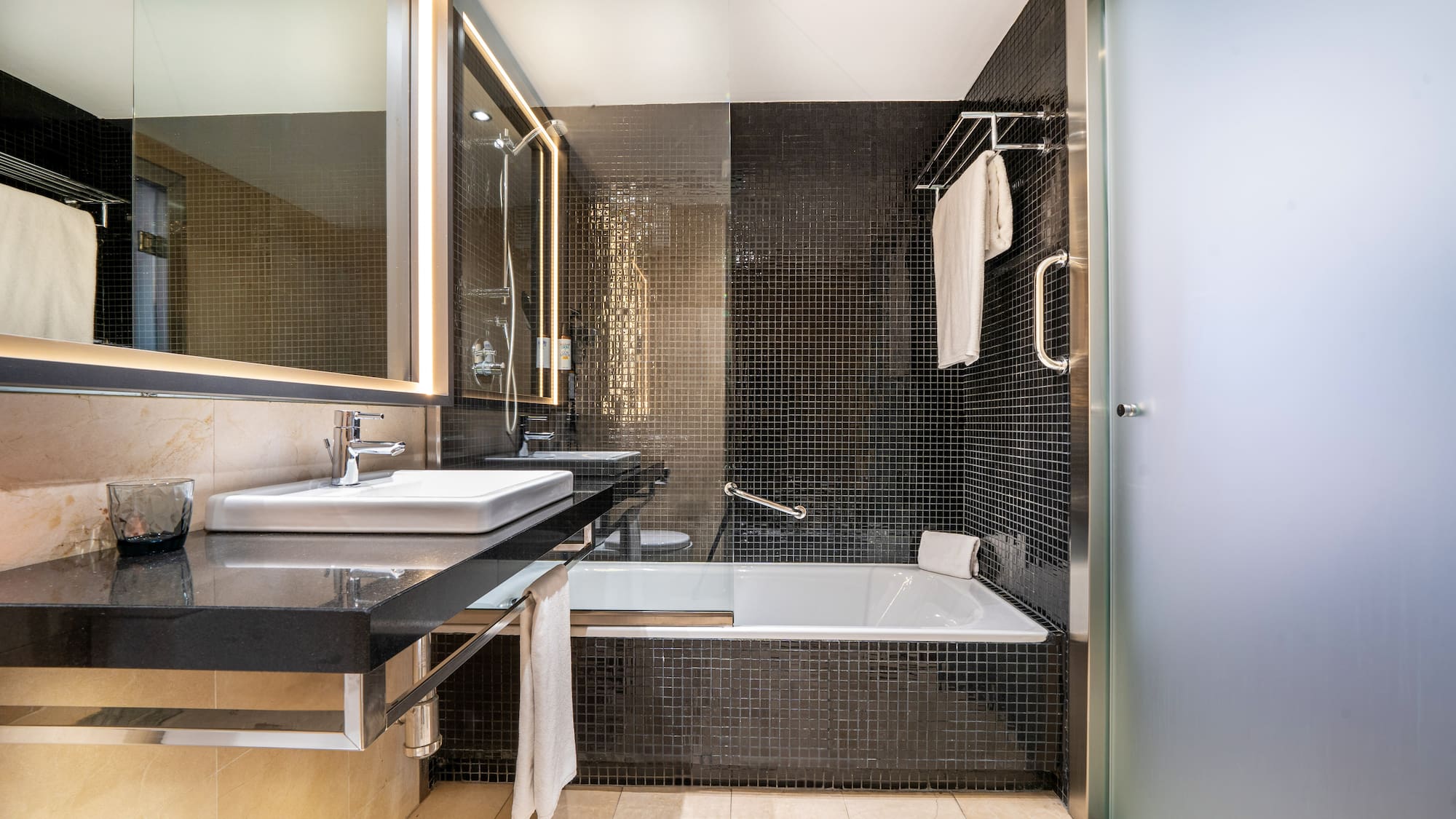 a bathroom with a bathtub and sink