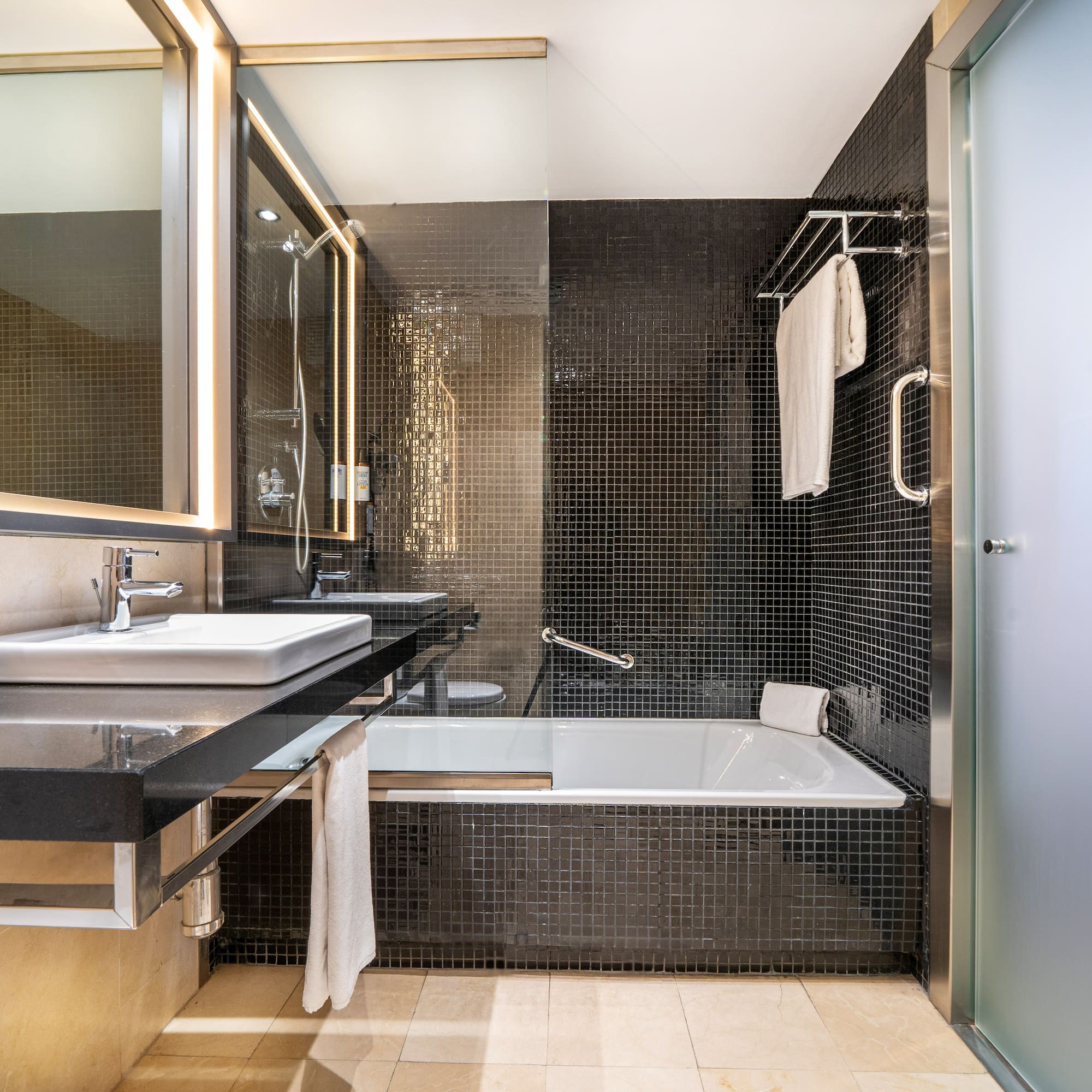 a bathroom with a bathtub and sink