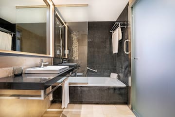 a bathroom with a bathtub and sink