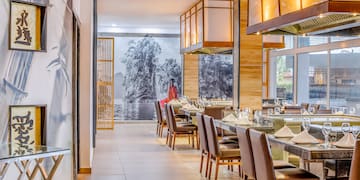 a restaurant with tables and chairs