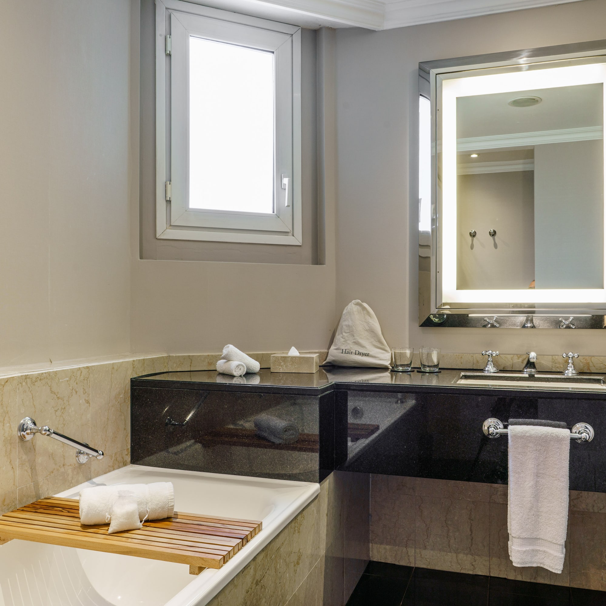 a bathroom with a bathtub and a mirror