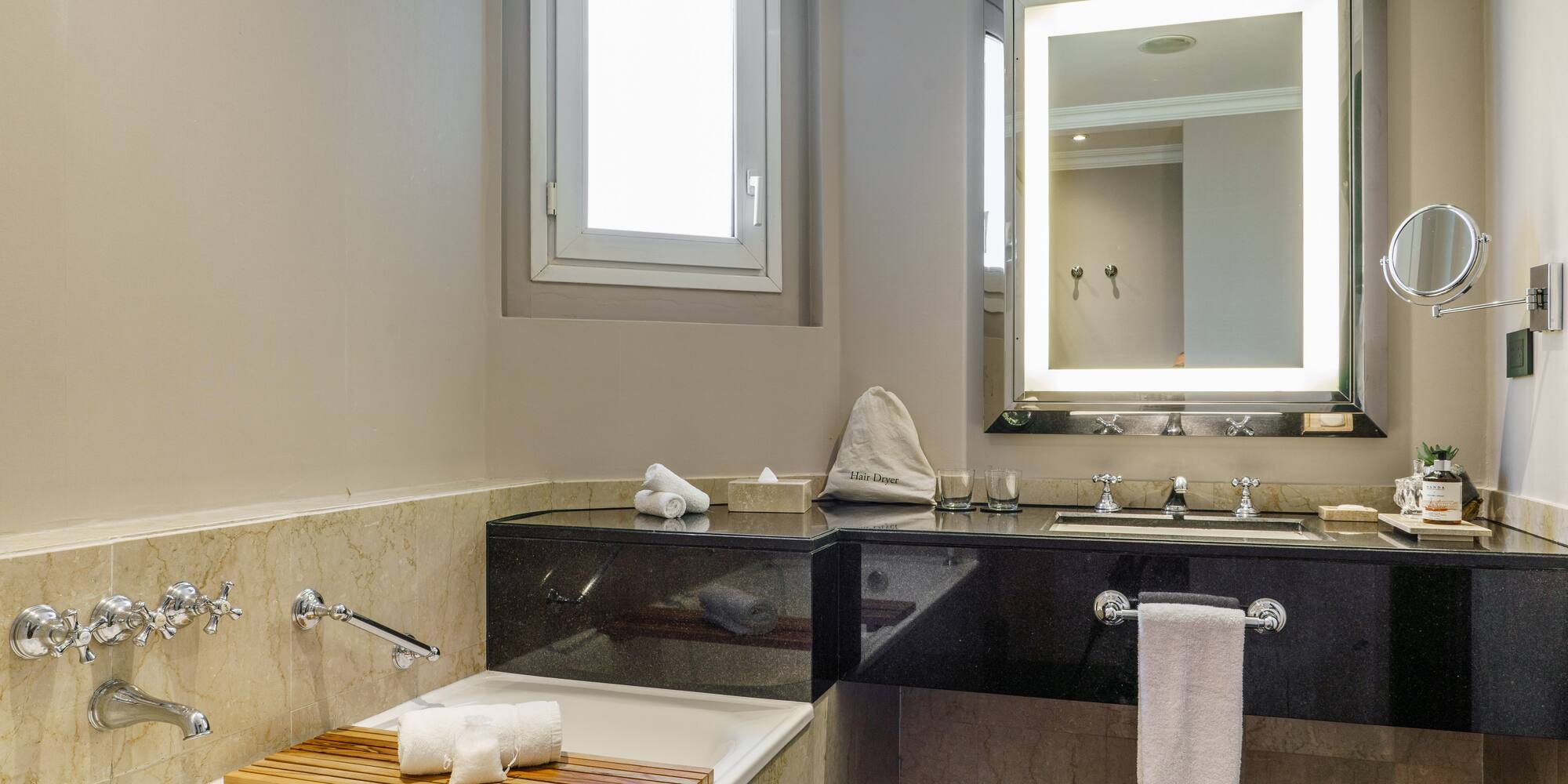 a bathroom with a bathtub and a mirror