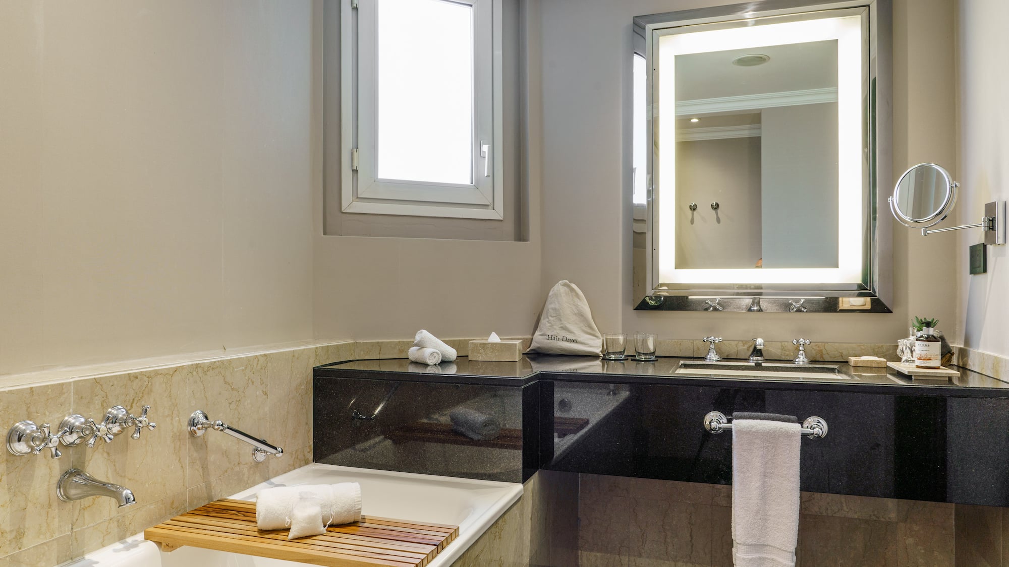 a bathroom with a bathtub and a mirror