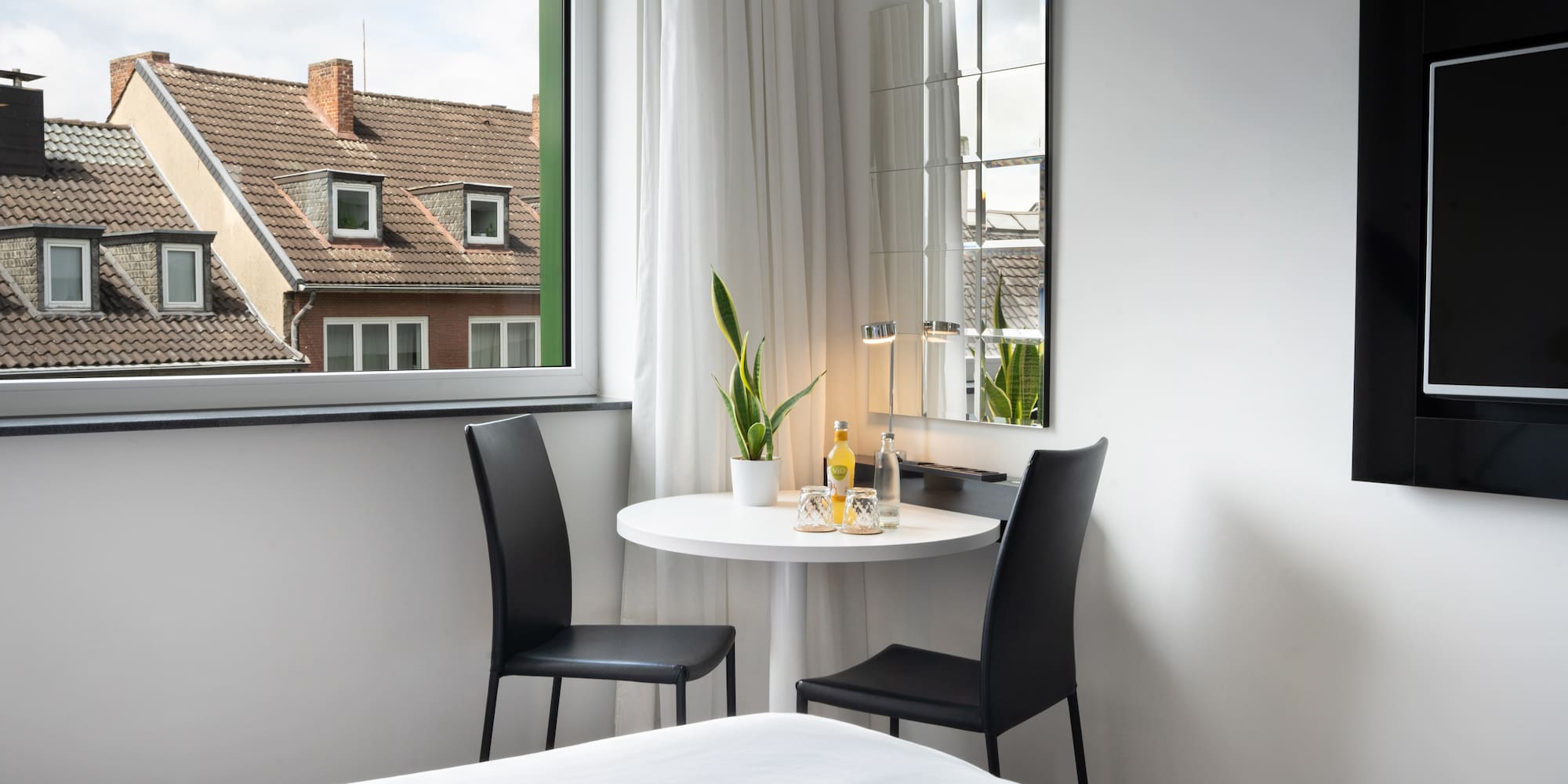 a room with a table and chairs