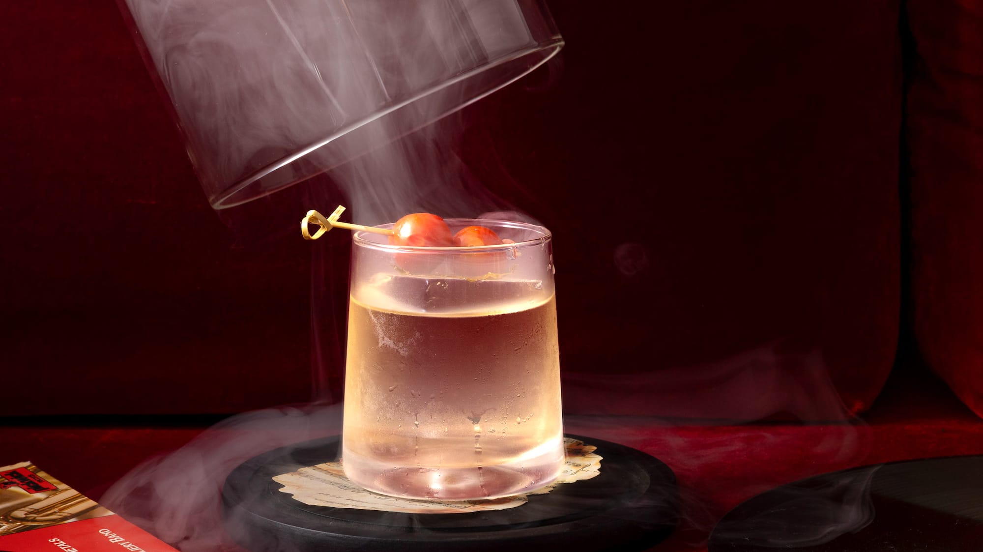 a person pouring a liquid into a glass