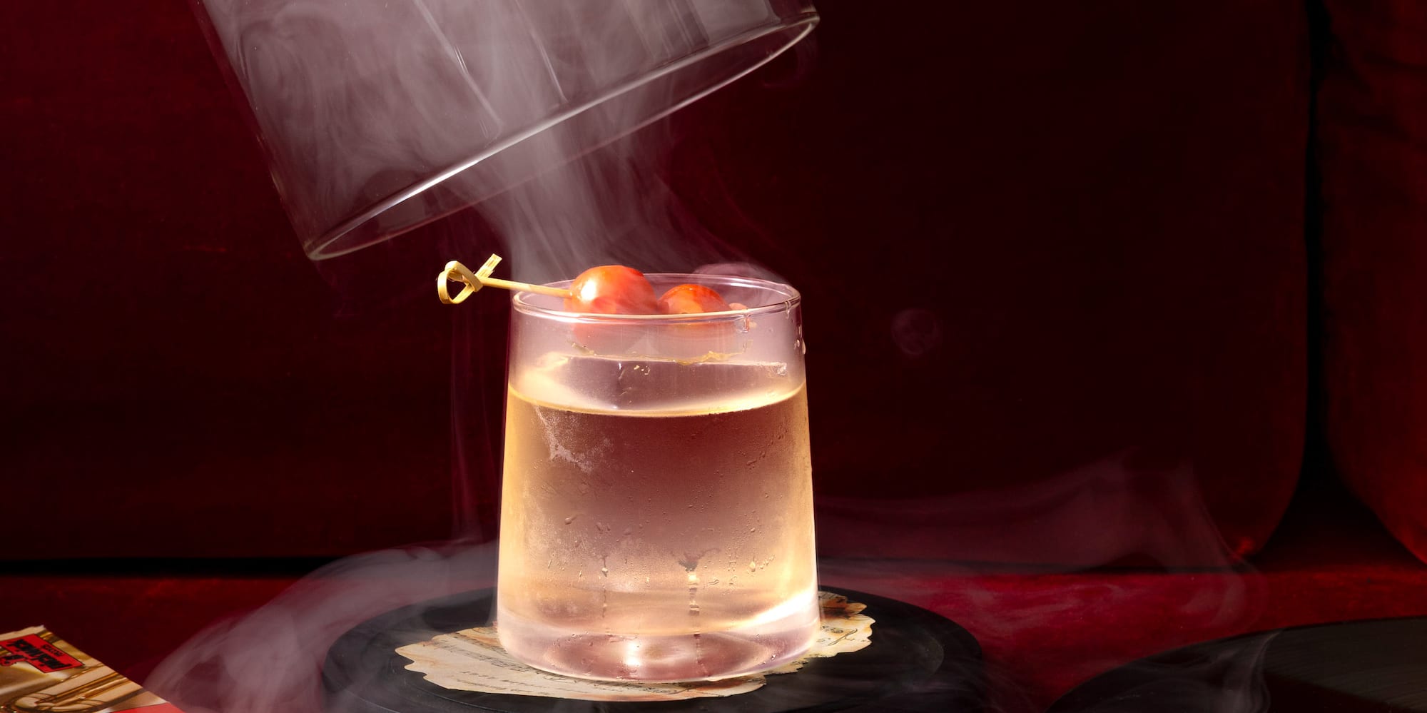 a person pouring a liquid into a glass