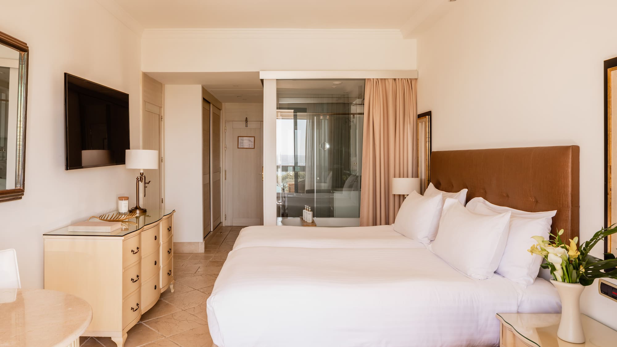 a bedroom with a bed and a dresser