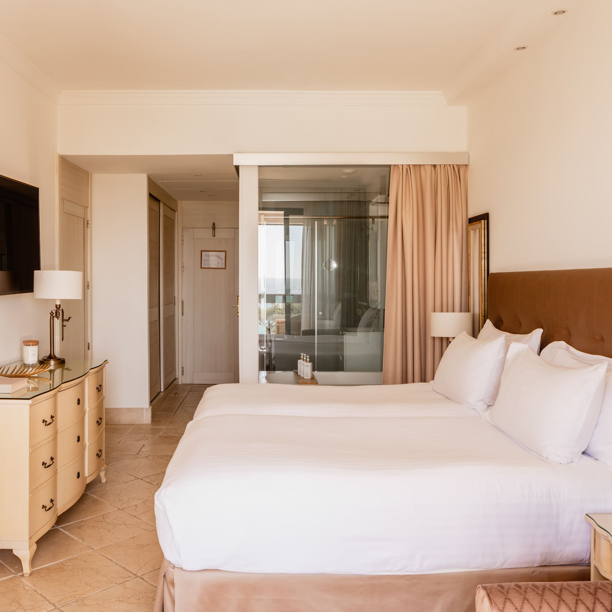 a bedroom with a bed and a dresser