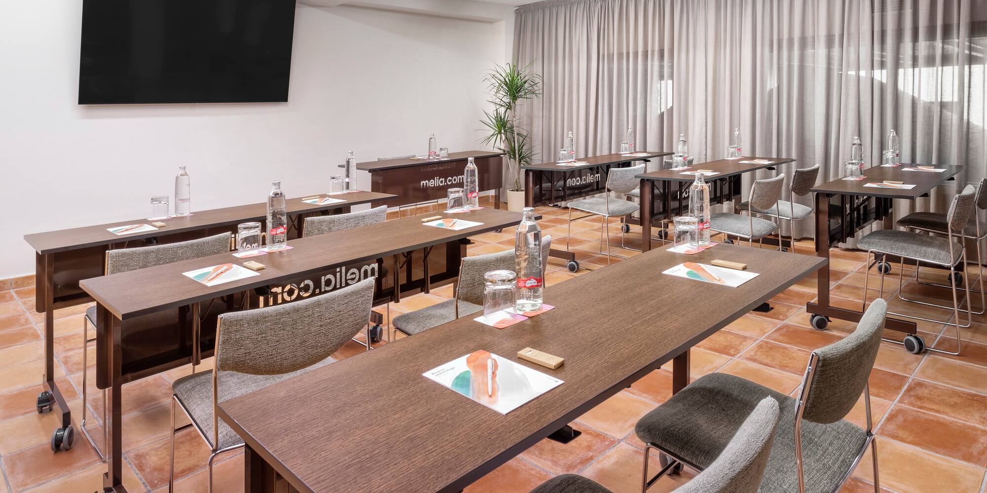 a room with tables and chairs