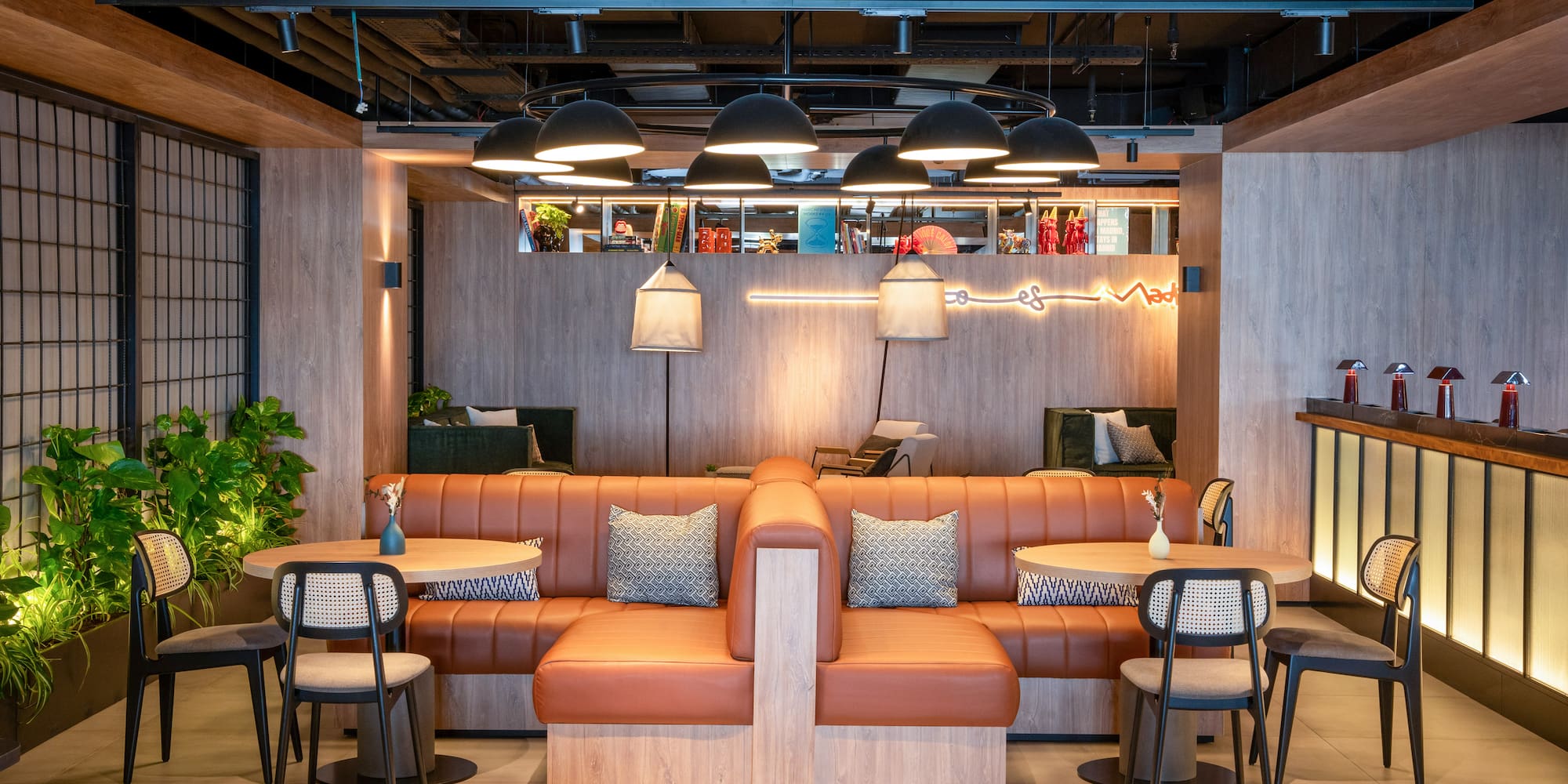 a room with a couch and chairs