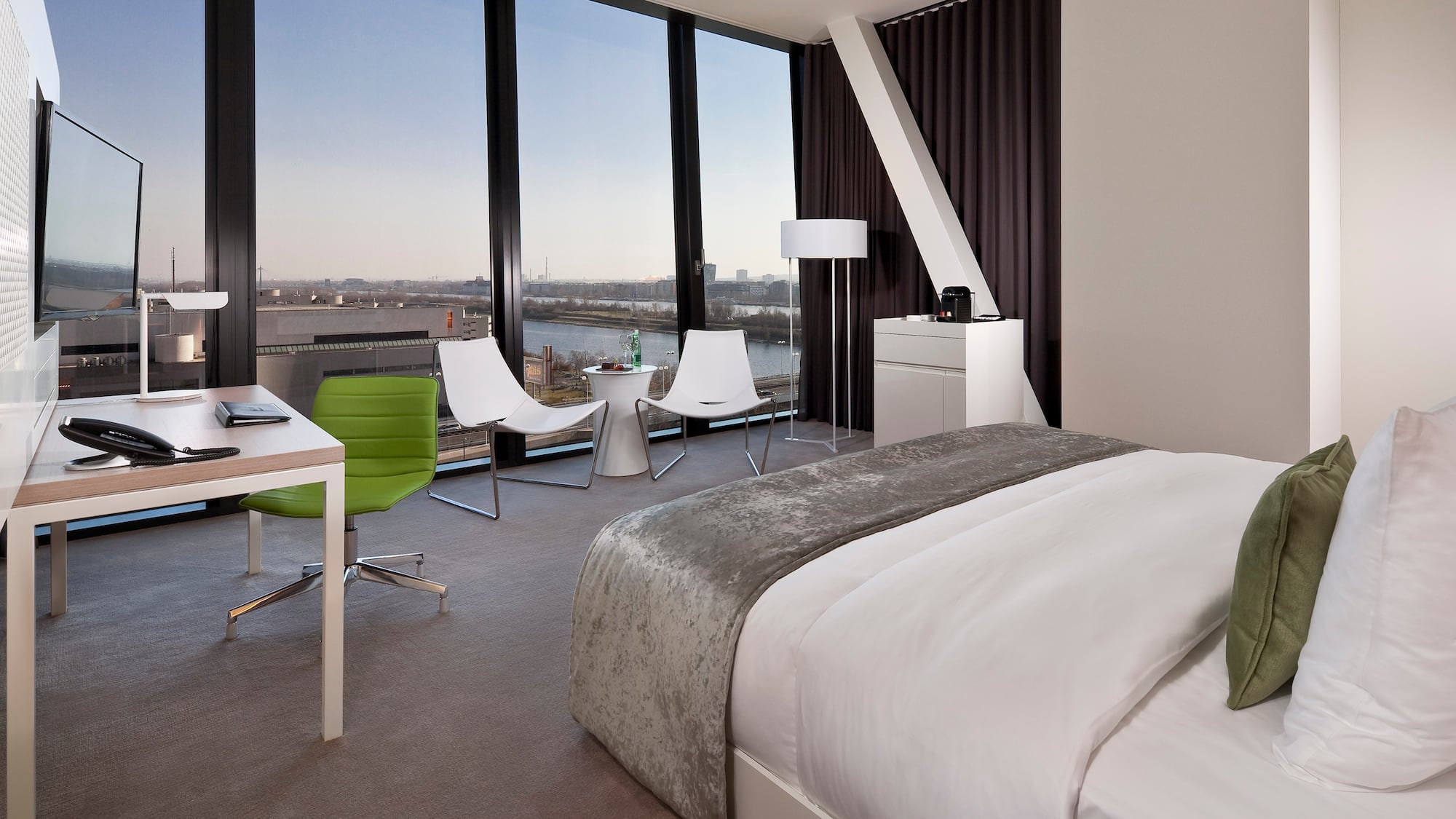 a room with a large window overlooking a city