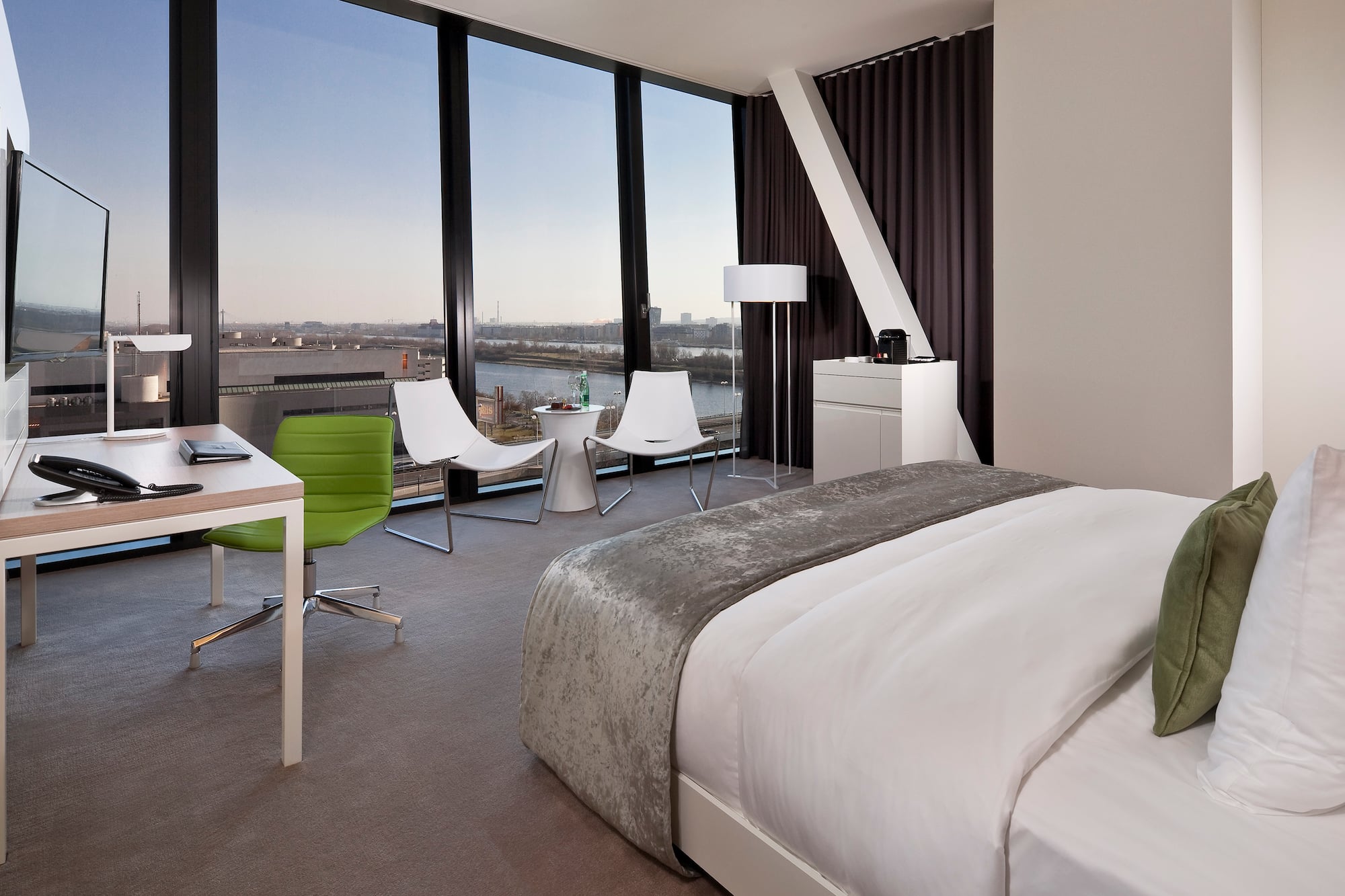 a room with a large window overlooking a city