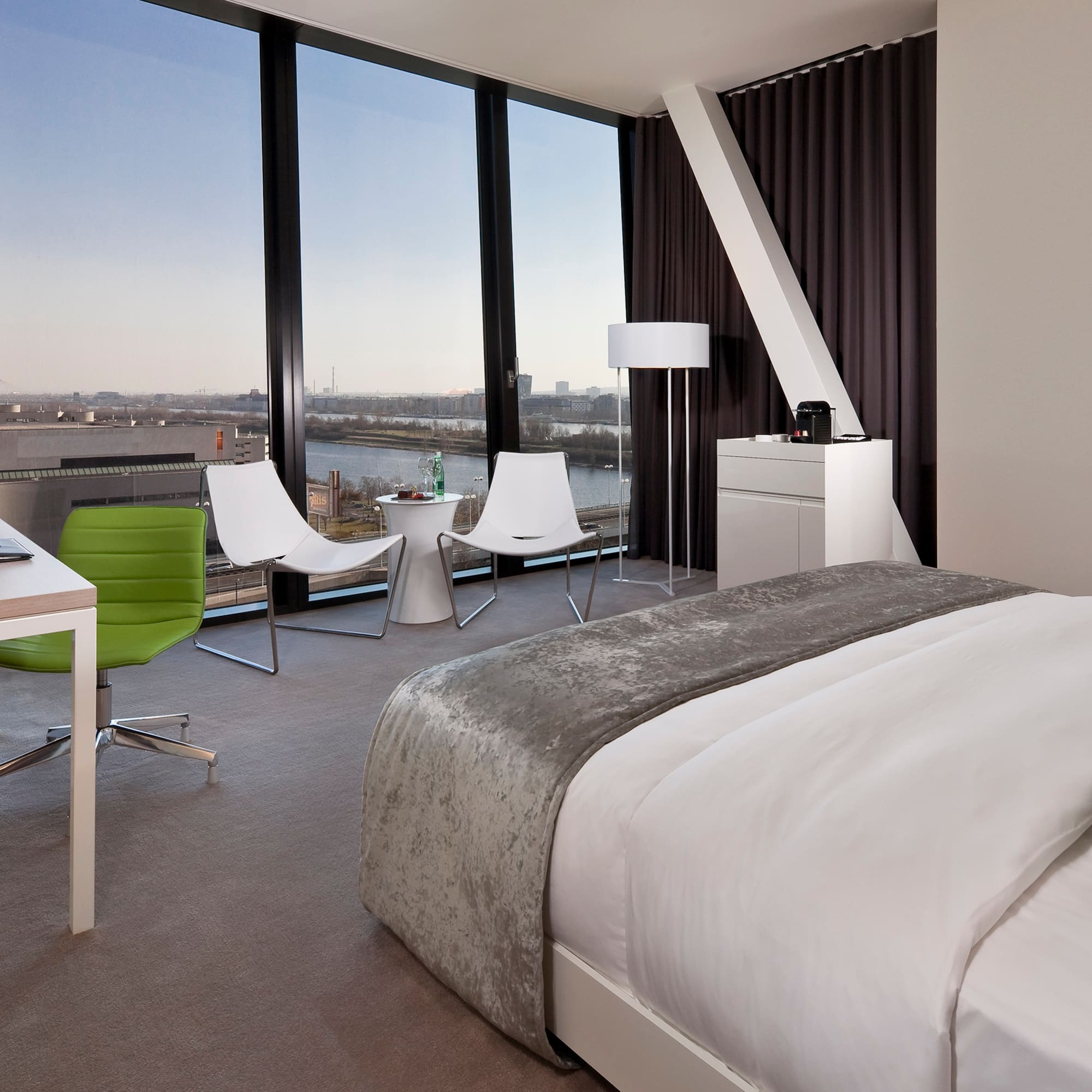 a room with a large window overlooking a city