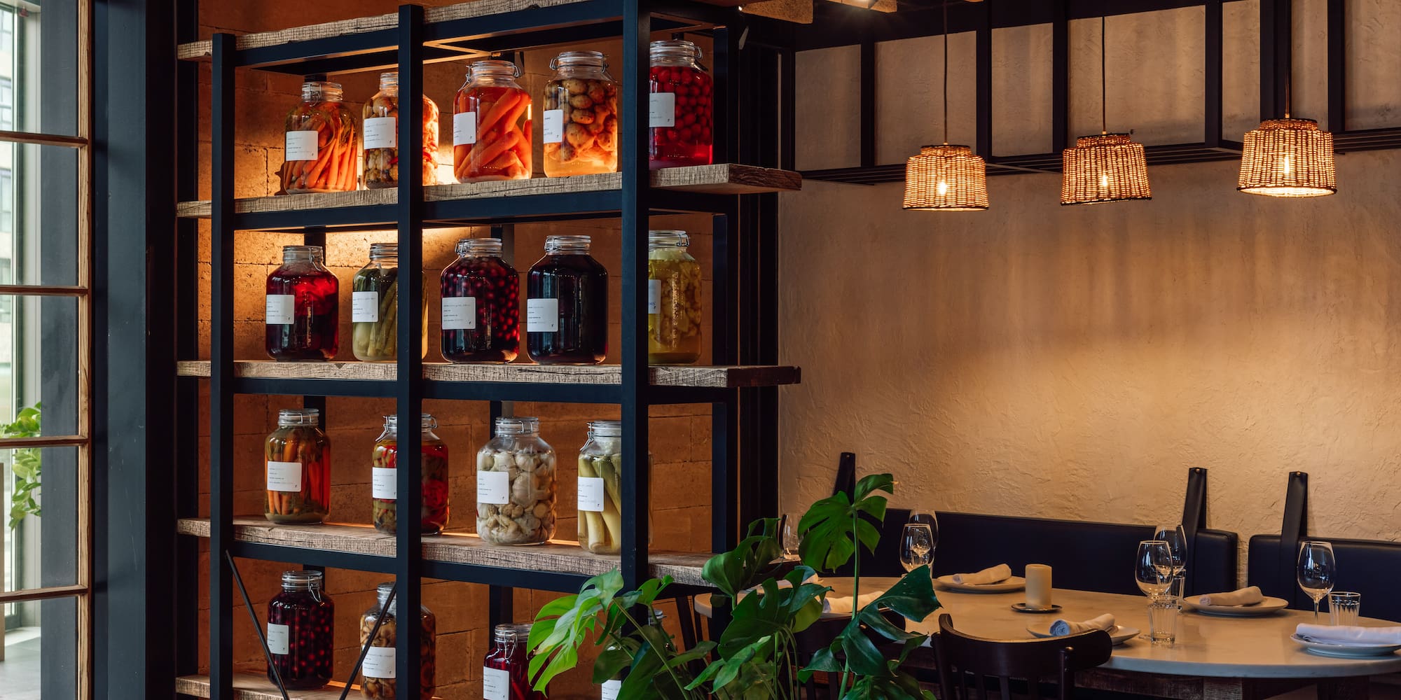 a shelf with jars of food and vegetables
