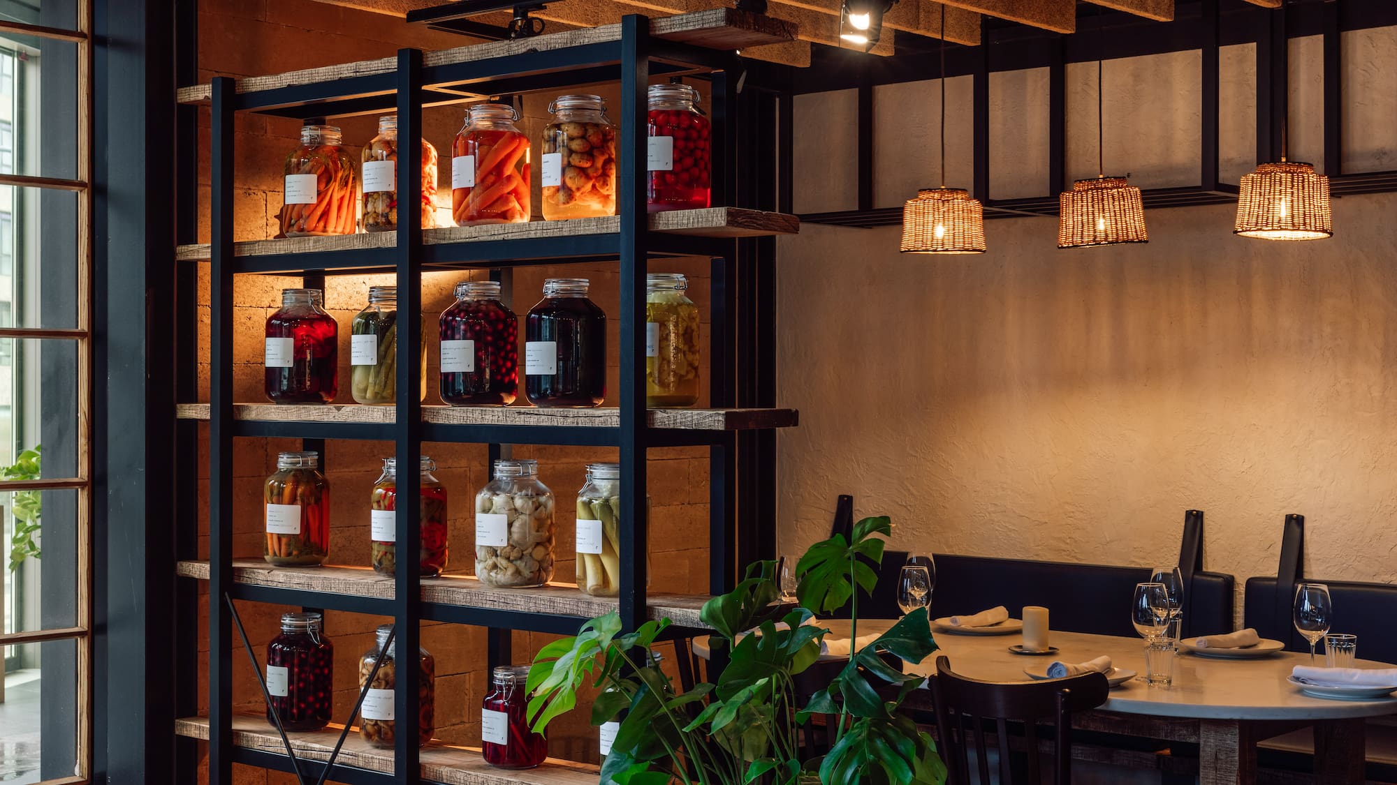 a shelf with jars of food and vegetables