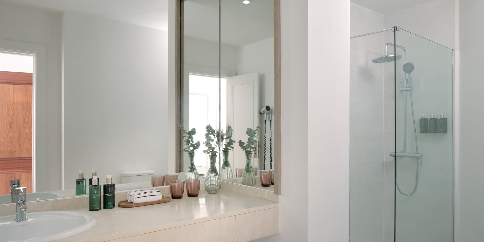 a bathroom with a mirror and a sink