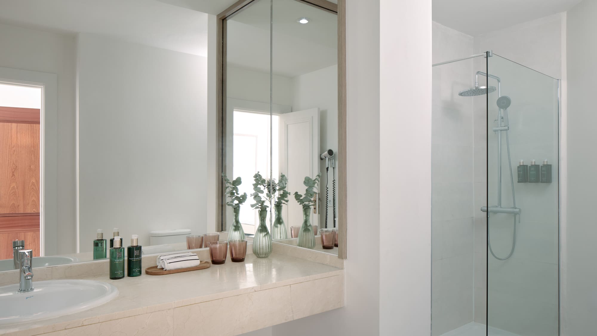 a bathroom with a mirror and a sink