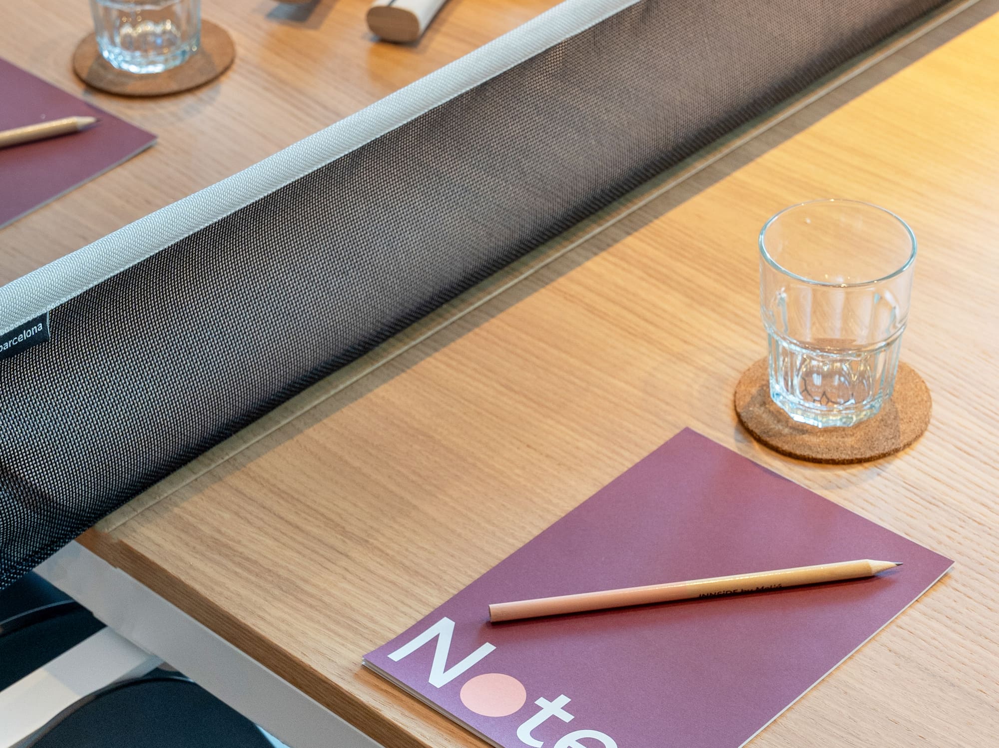 a table with a notepad and a pencil on it