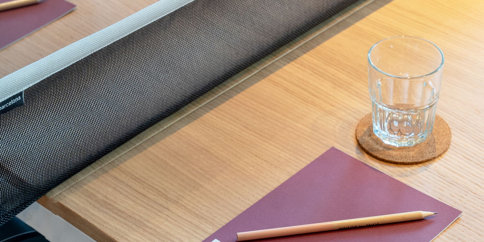 a table with a notepad and a pencil on it