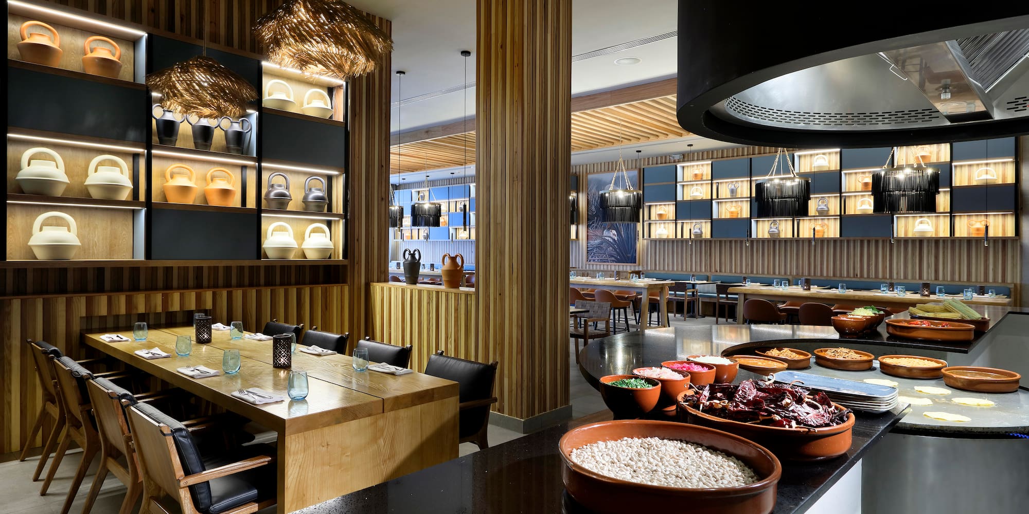 a restaurant with many plates of food