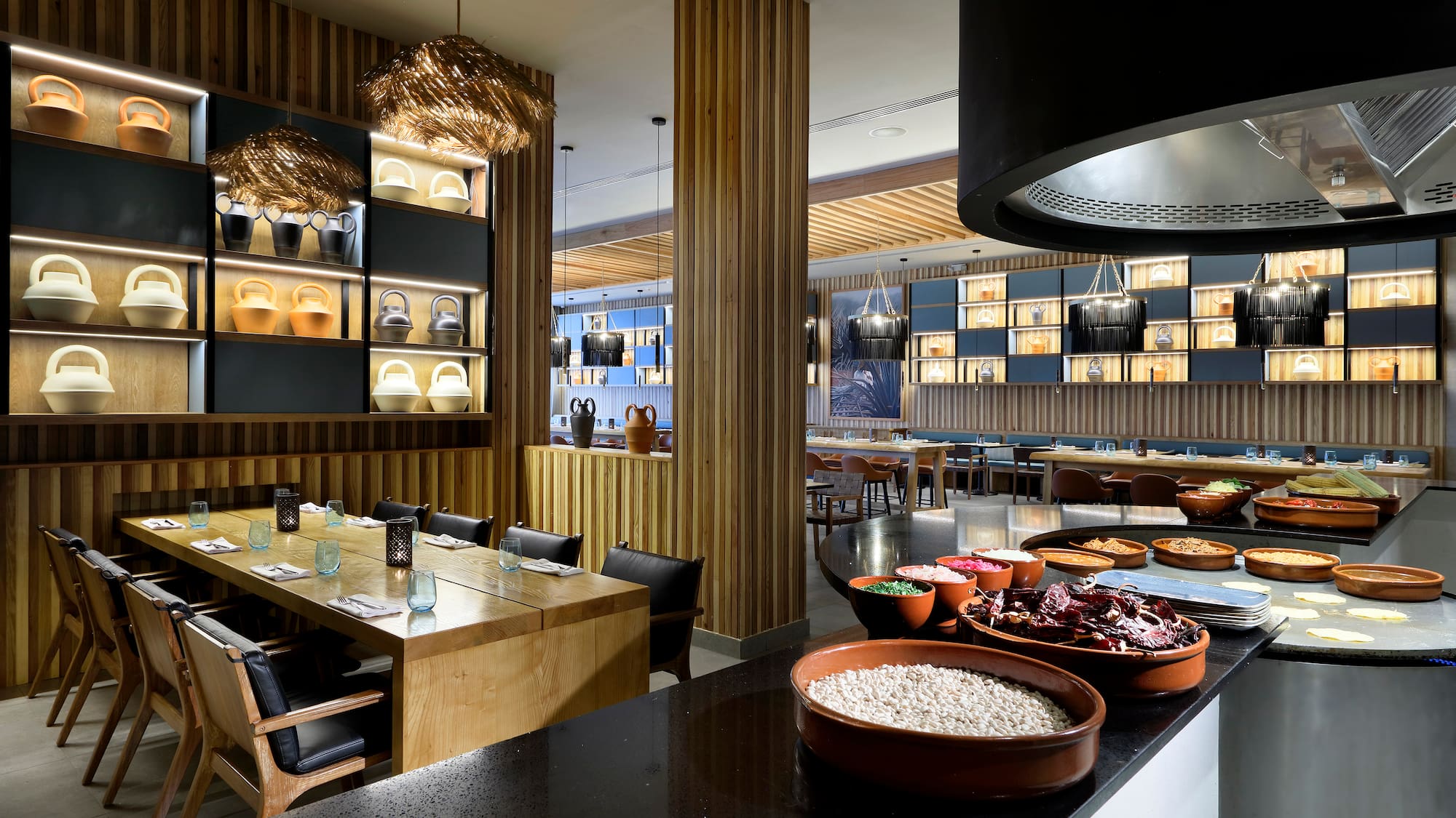 a restaurant with many plates of food