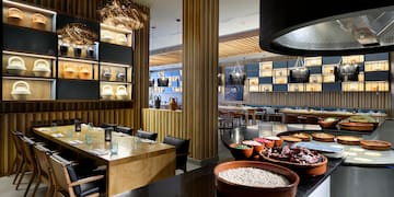 a restaurant with many plates of food