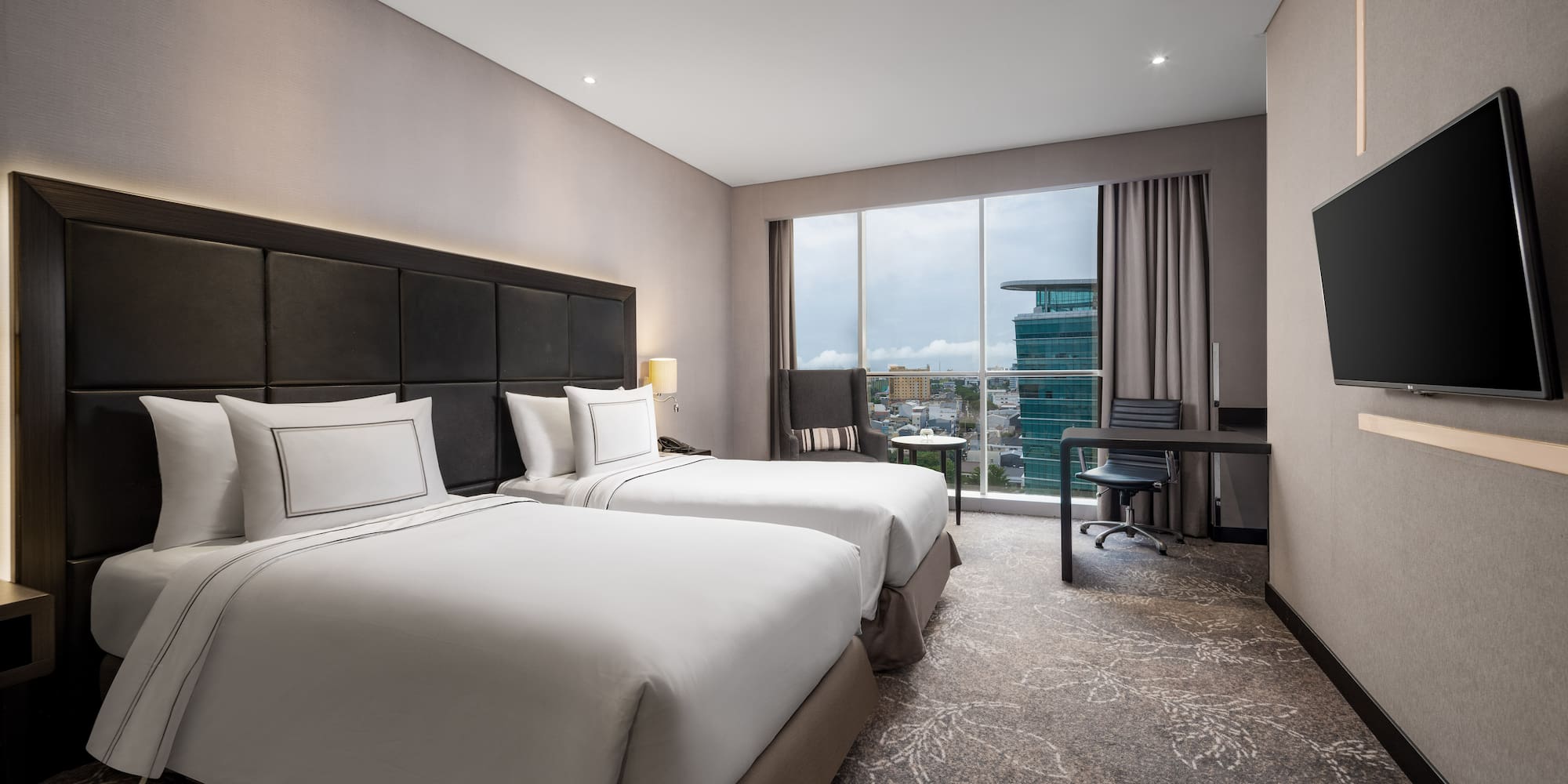 a hotel room with two beds