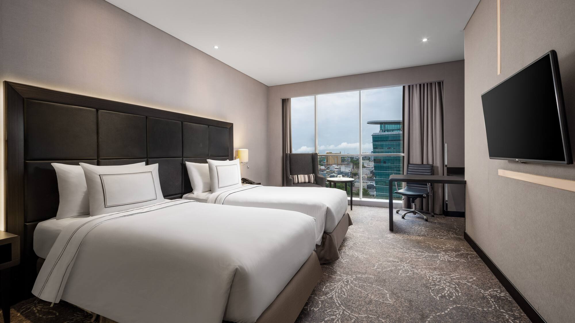 a hotel room with two beds